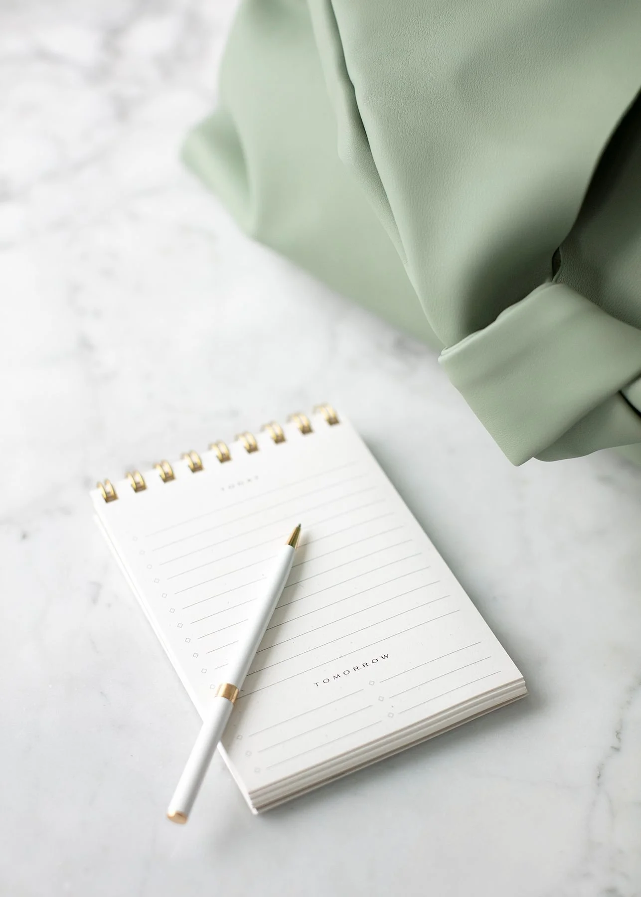 jacket-notebook-pencil-on desk