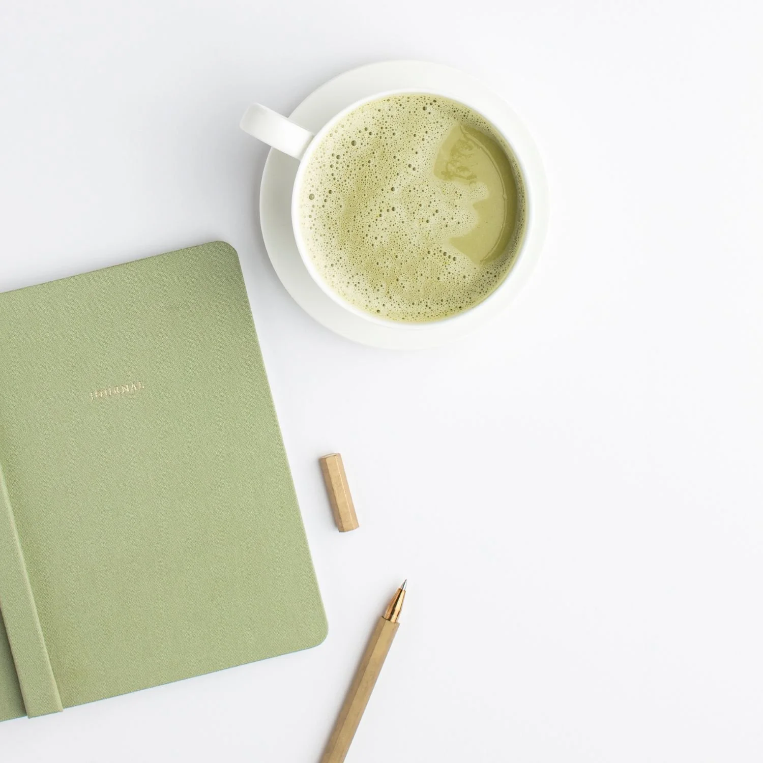 tea-green-notebook-and-pencil