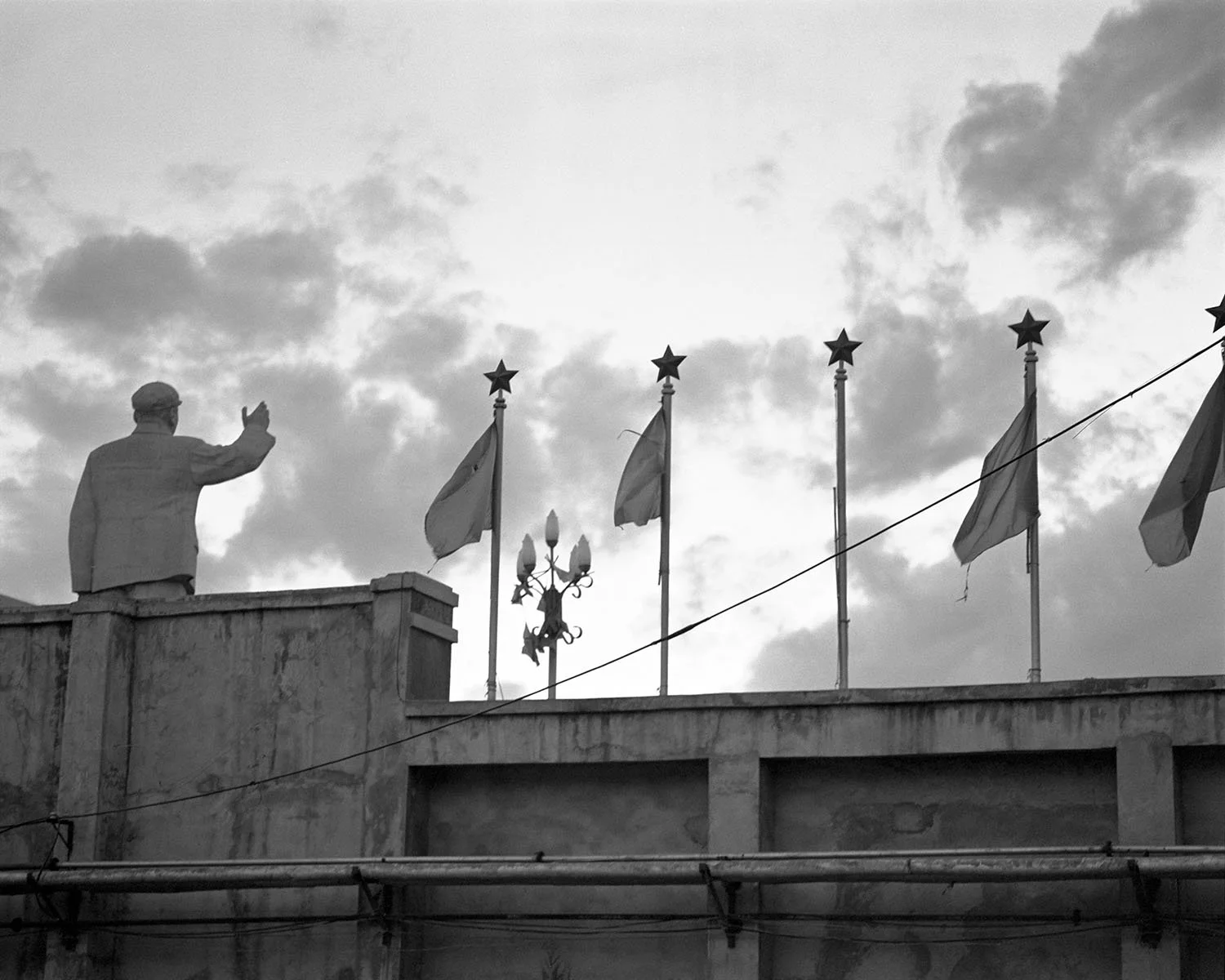 Statue of Mao Zedong in a public square in Lijiang, Yunnan Province, photographed in 2000.