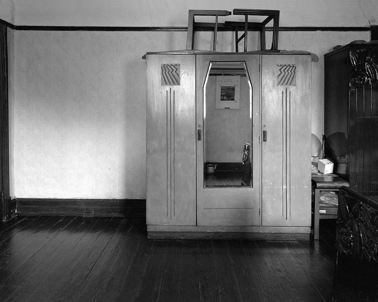 Art Deco wooden dresser with mirror located within a one-room apartment in Shanghai, 2002.