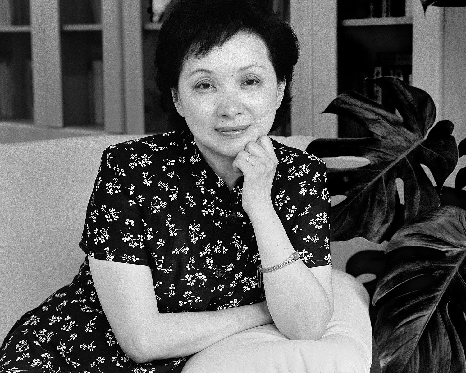 Portrait of Wang Xiaoying seated indoors, gender studies scholar in Shanghai, 2000.
