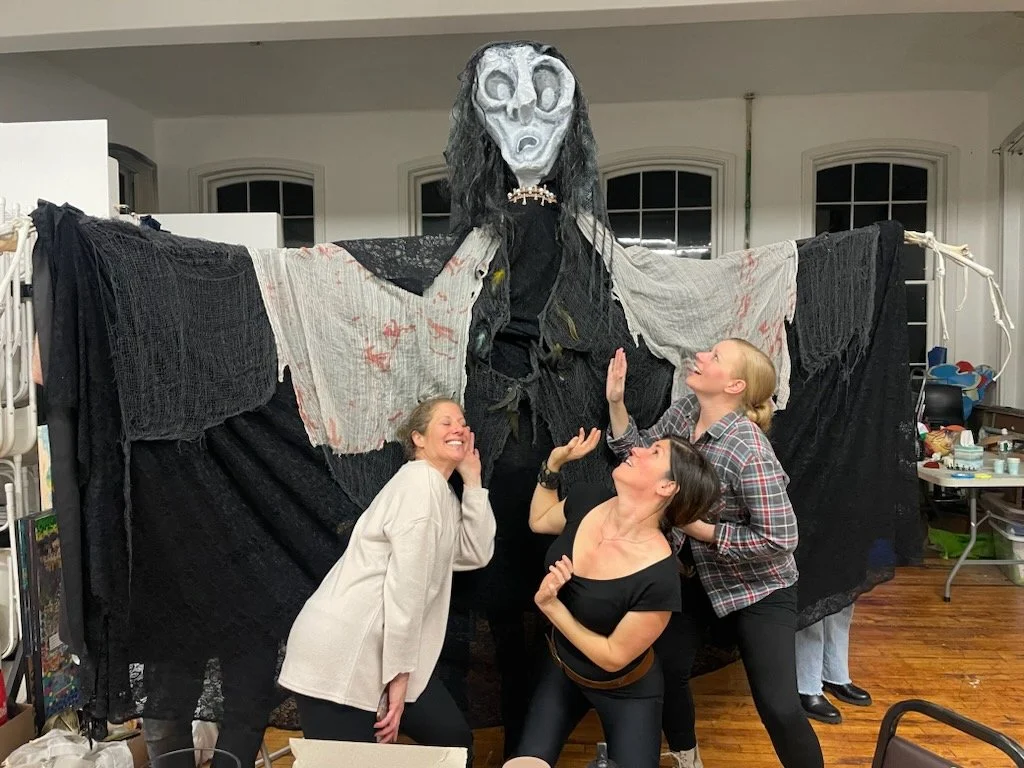 Hecate with witches (actors) looking impressed.