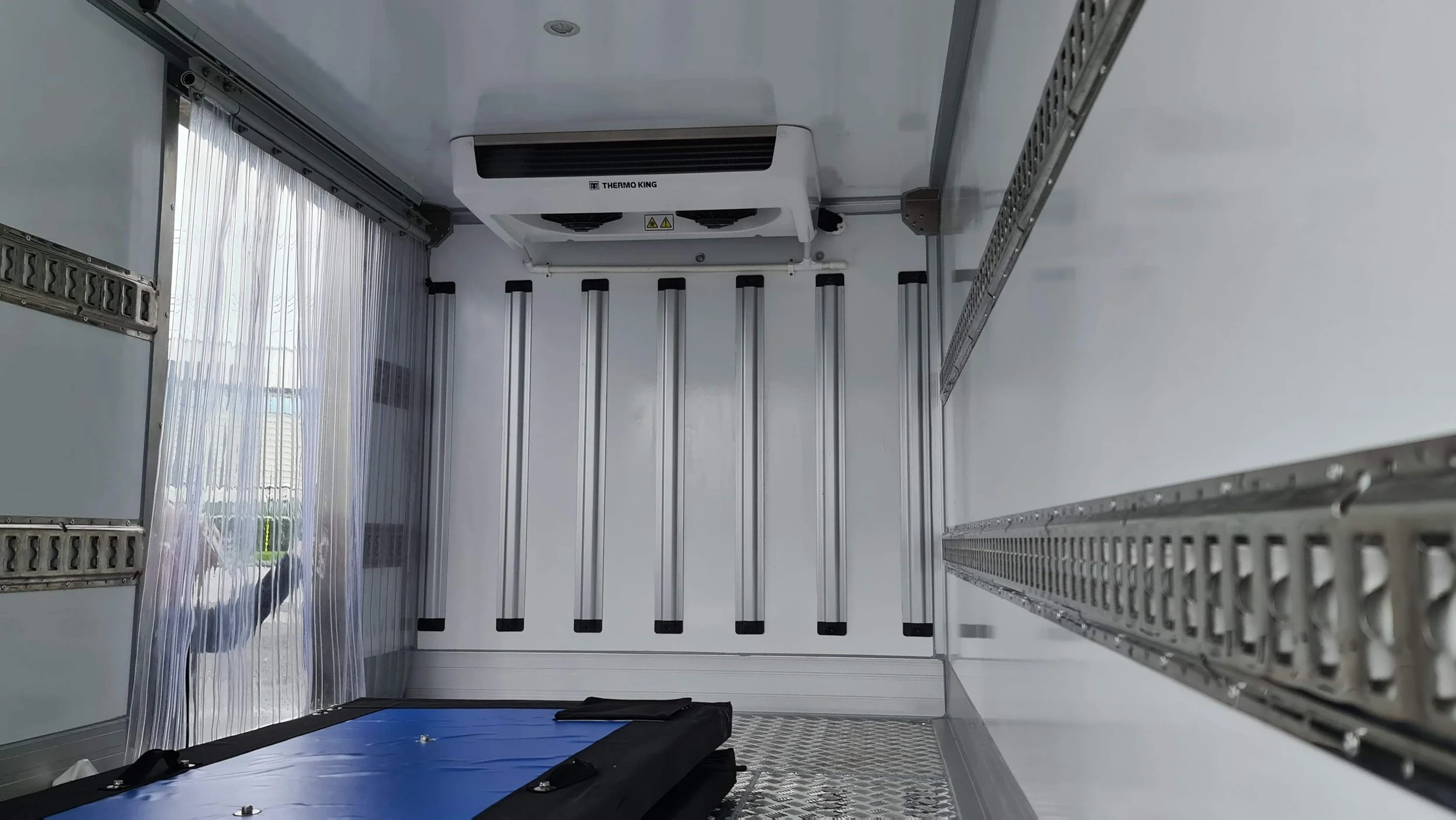 CARGO TRACKS AND STRIP CURTAIN