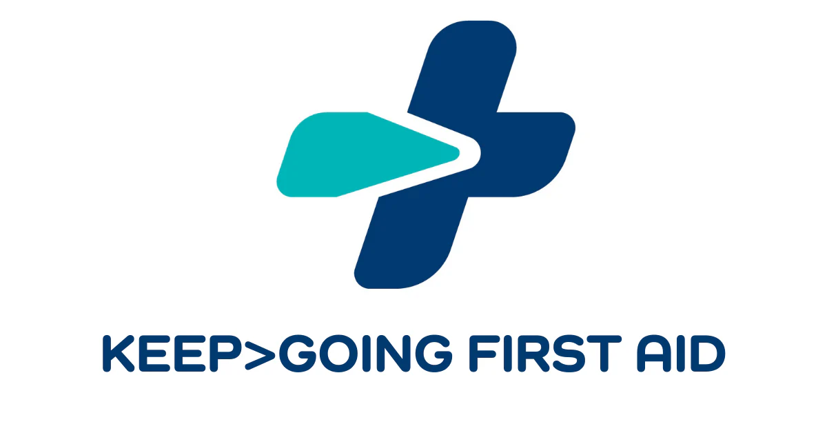 A stylized medical cross with a blue and teal color scheme and a small arrow integrated into the design; beneath it, the words "KEEP>GOING FIRST AID" are written in bold, blue letters.