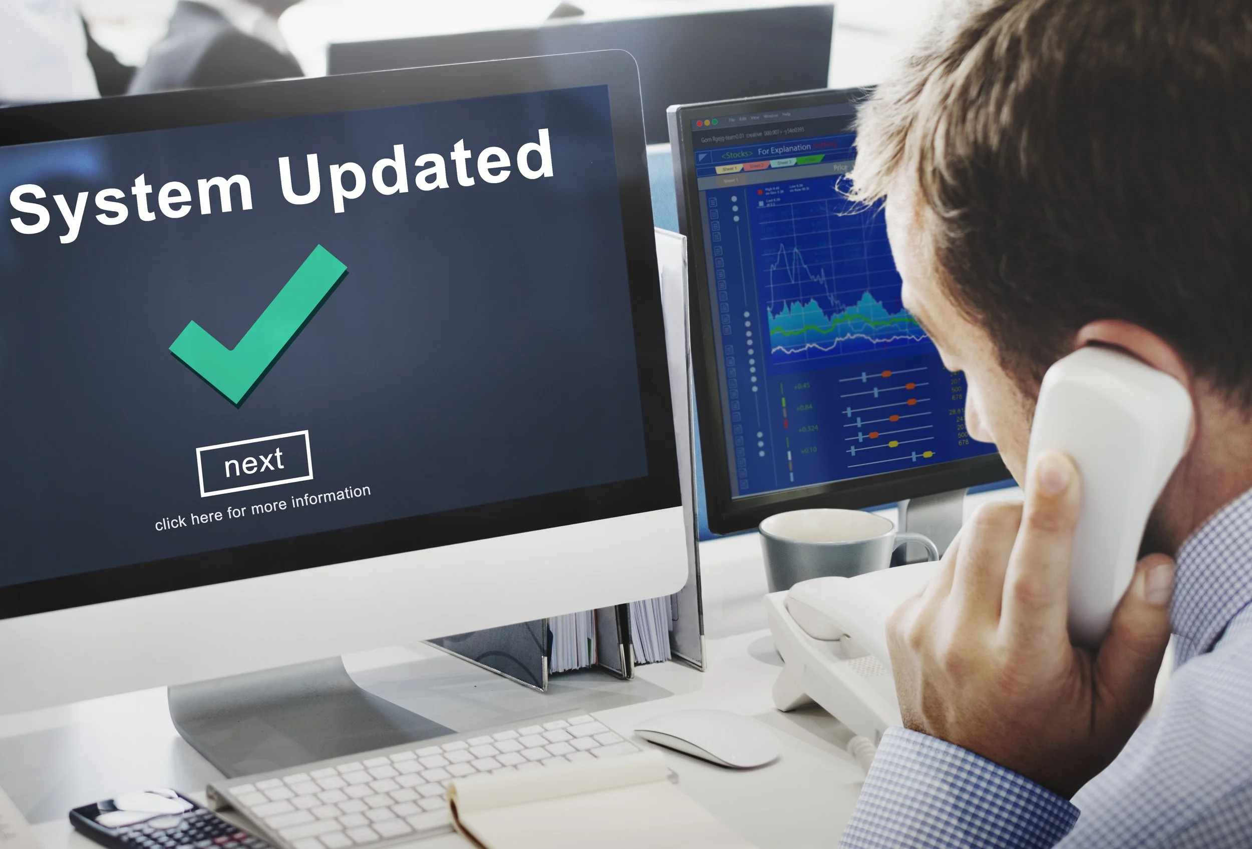 Tax professional at computer showing system update