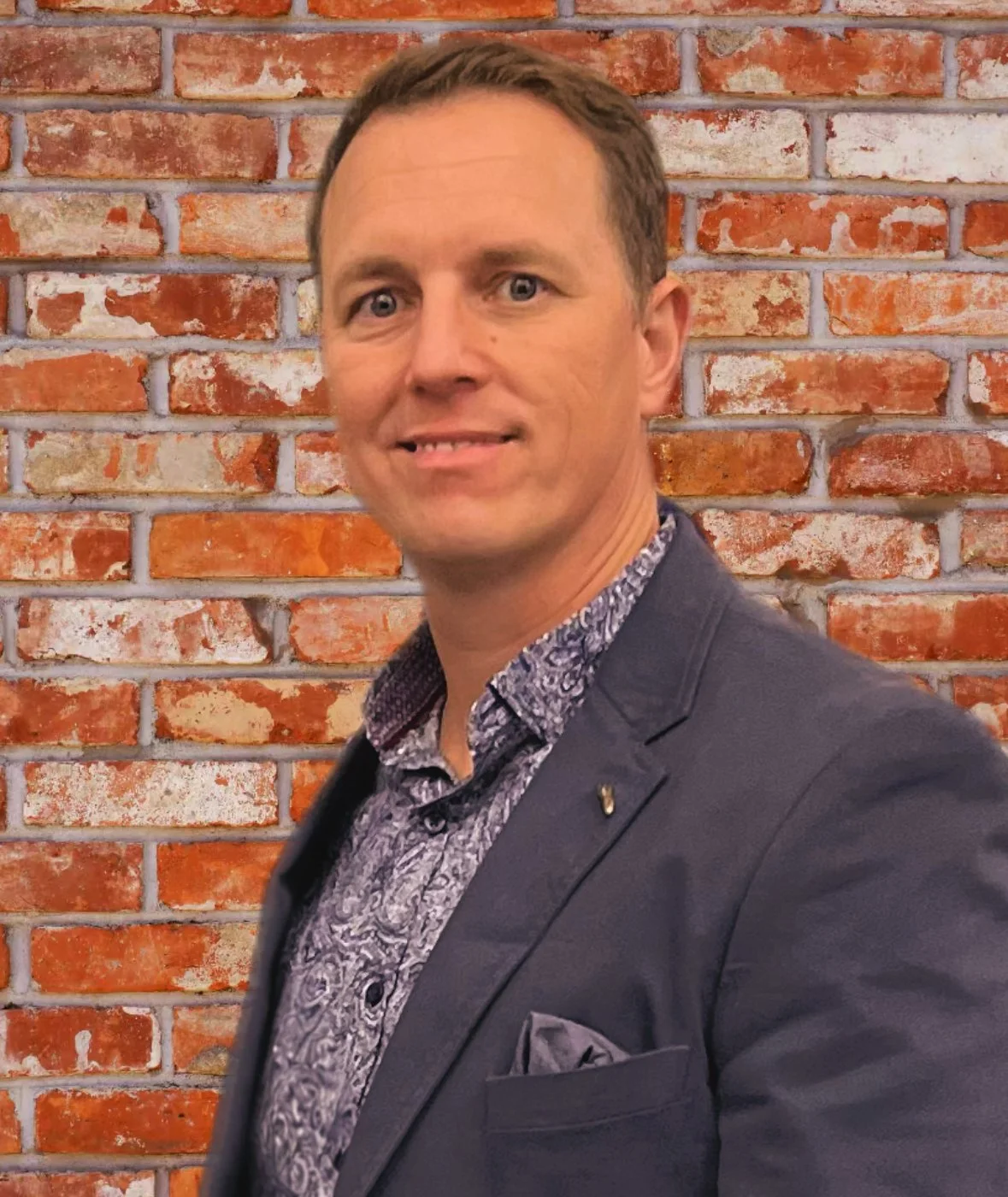 Man with beard and glasses wearing a dark sweater