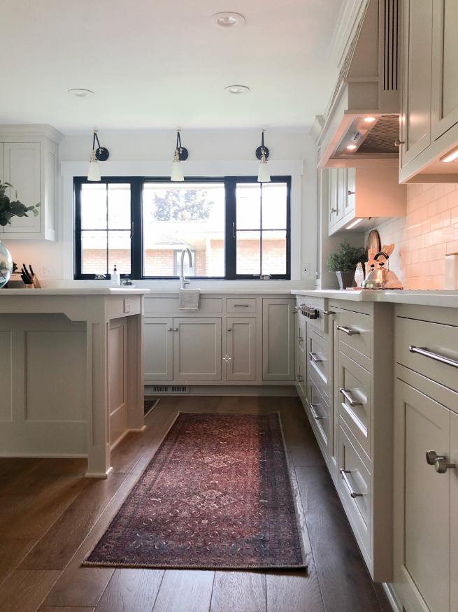 One of my favorite features in this kitchen are the 3 wall sconces that add a modern touch.