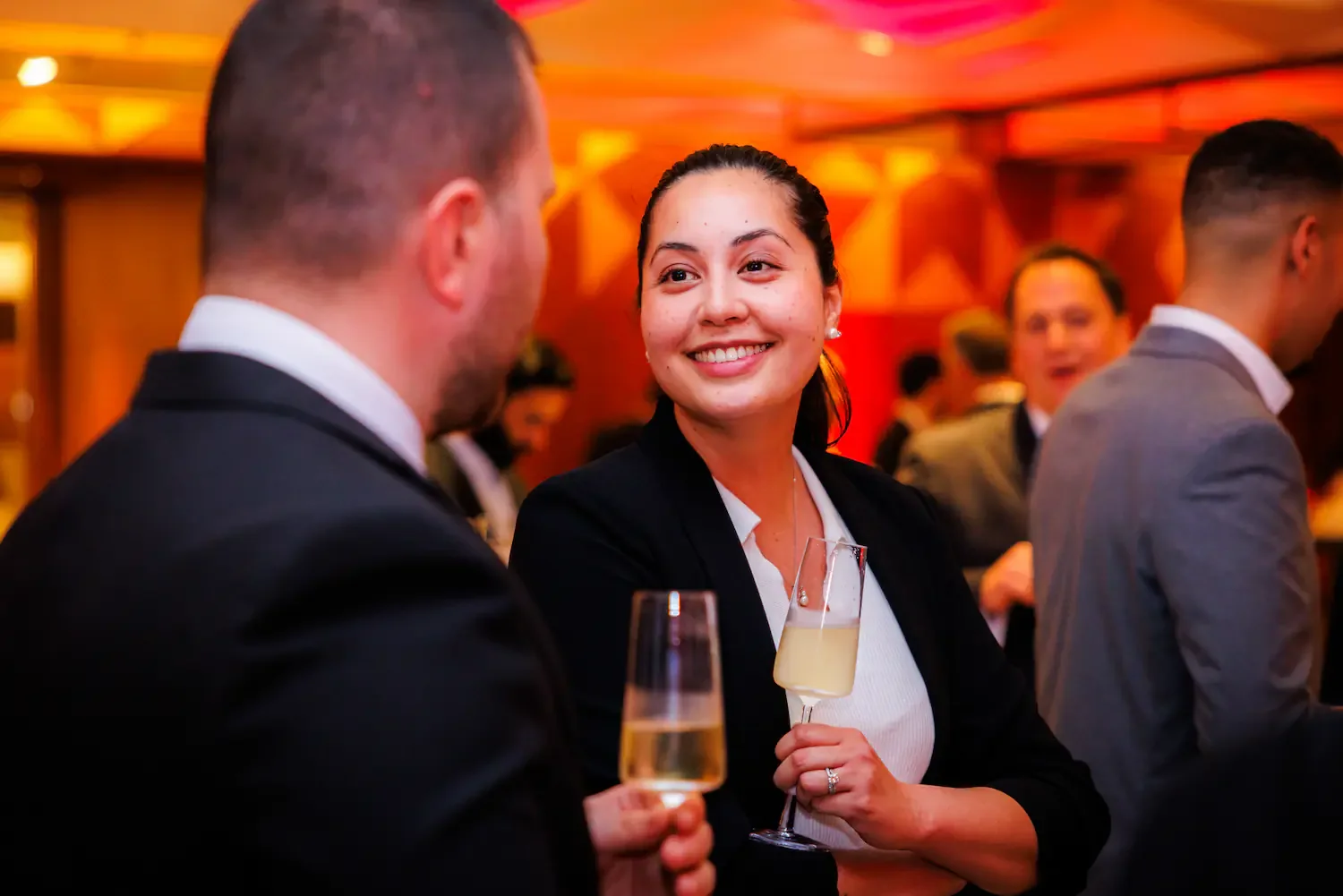 Candid drinks reception moment