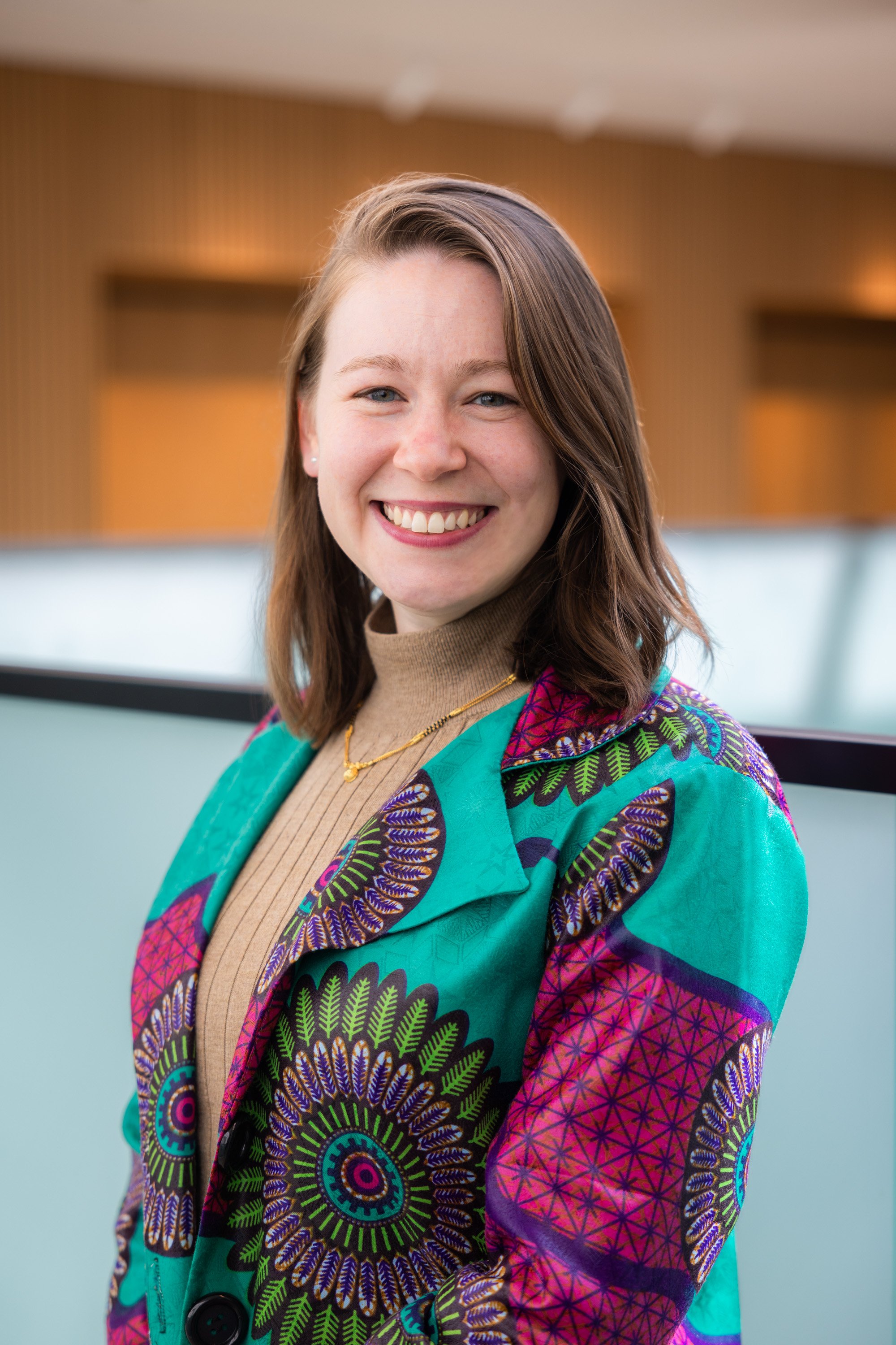 Indoor corporate headshot talen alongside an event