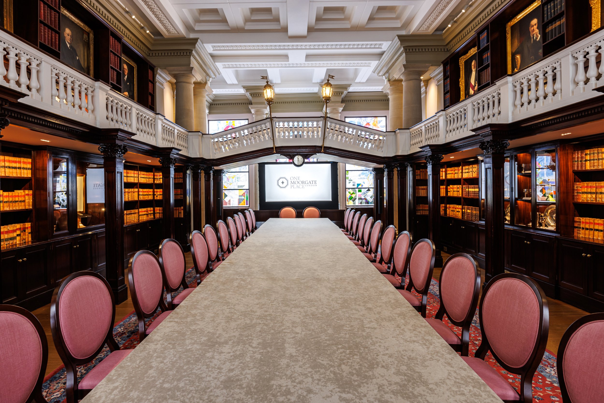 Library with a long table prepared for a networking event