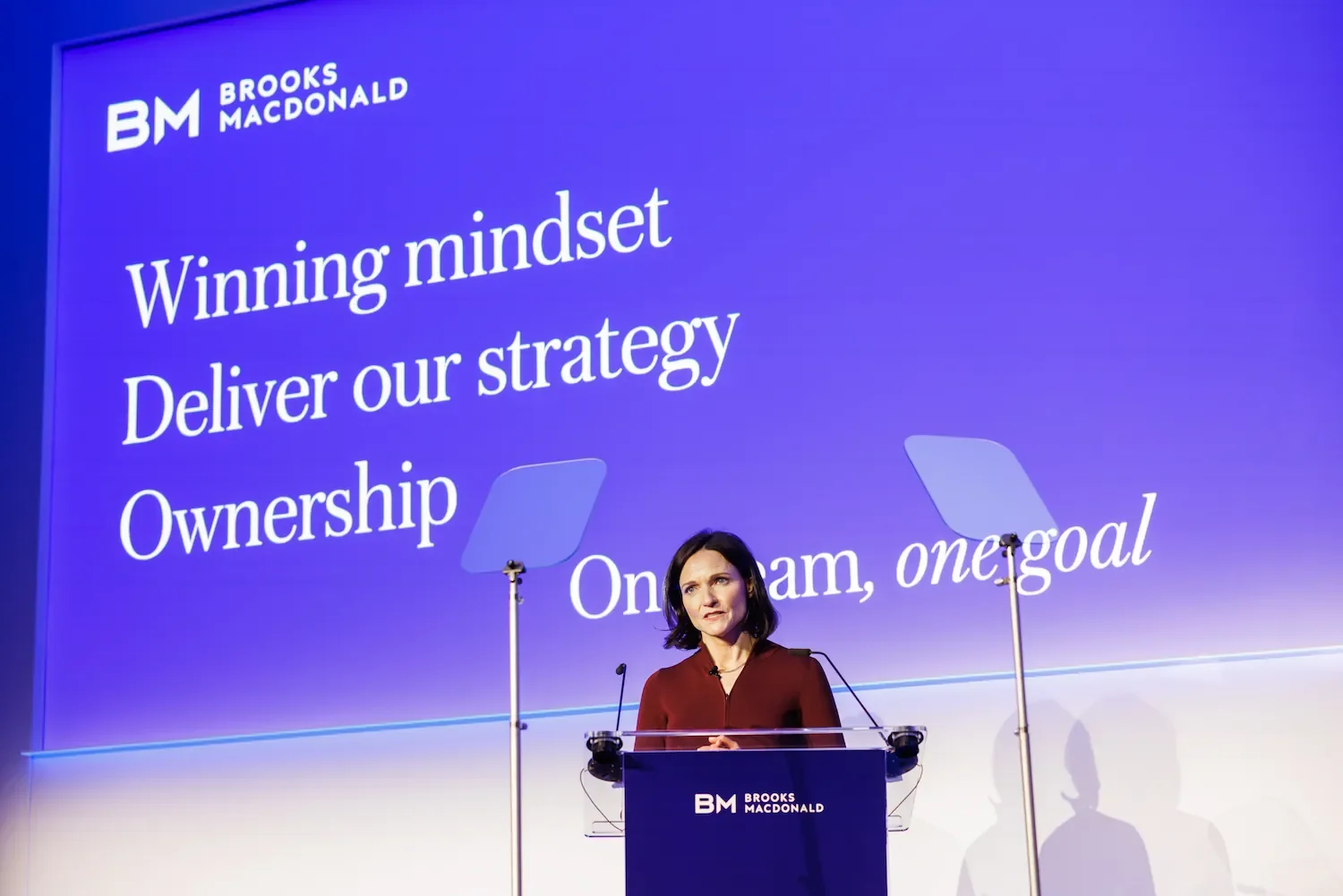 CEO addresses audience during annual management summit