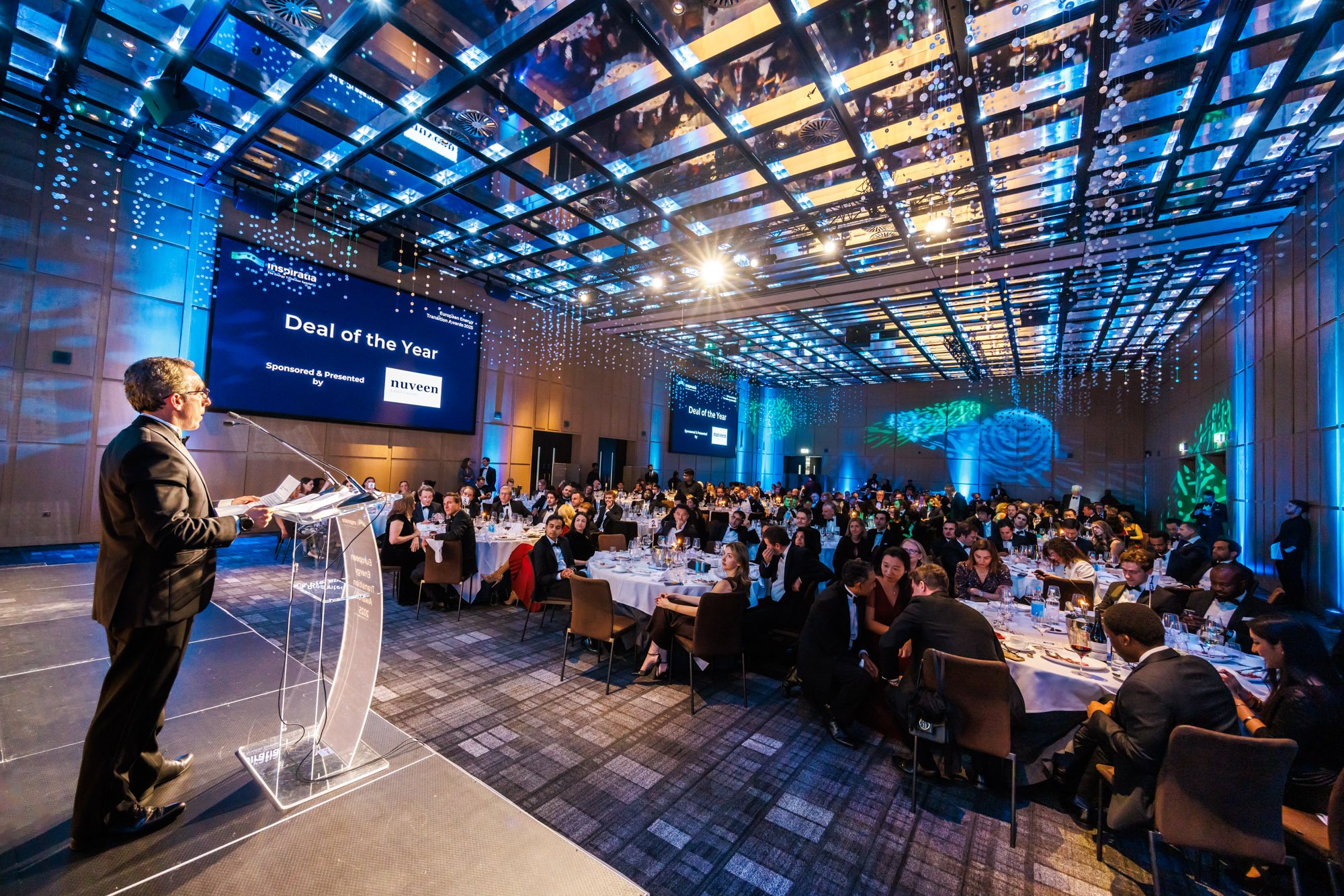 Award ceremony host addressing guests during gala dinner