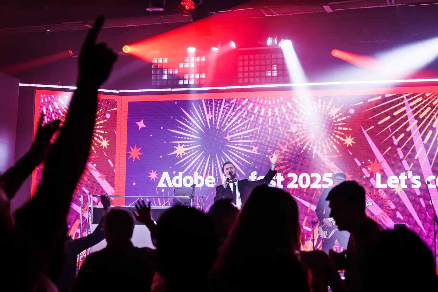 Adobe awards celebration with stage lighting and large audience