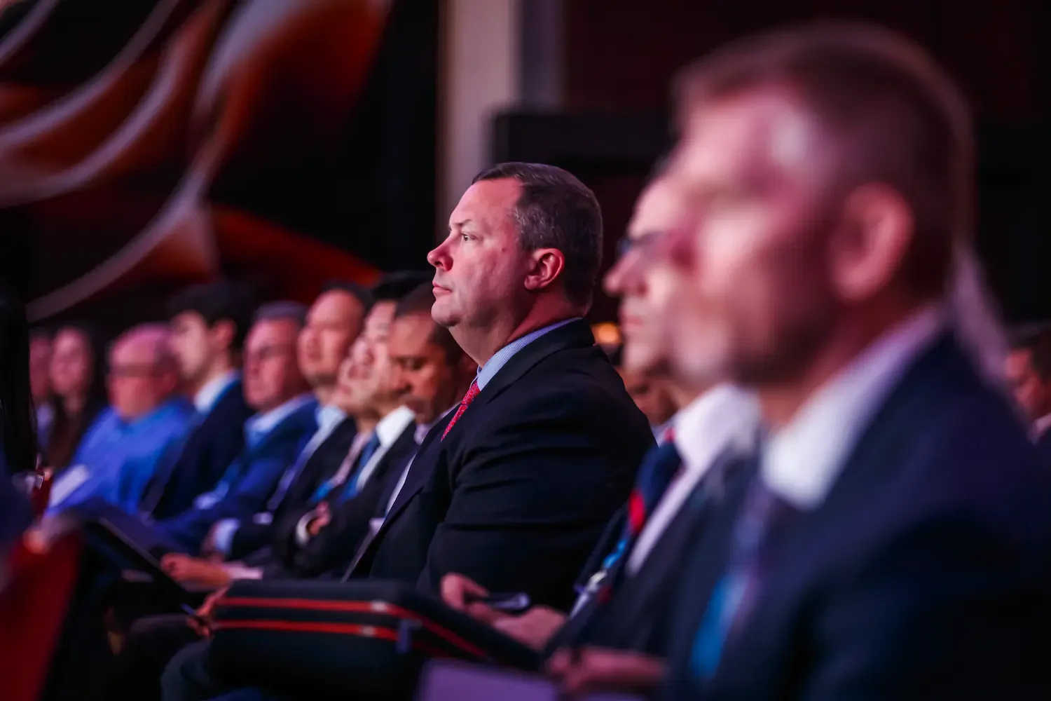 Conference audience engaged during live keynote presentation