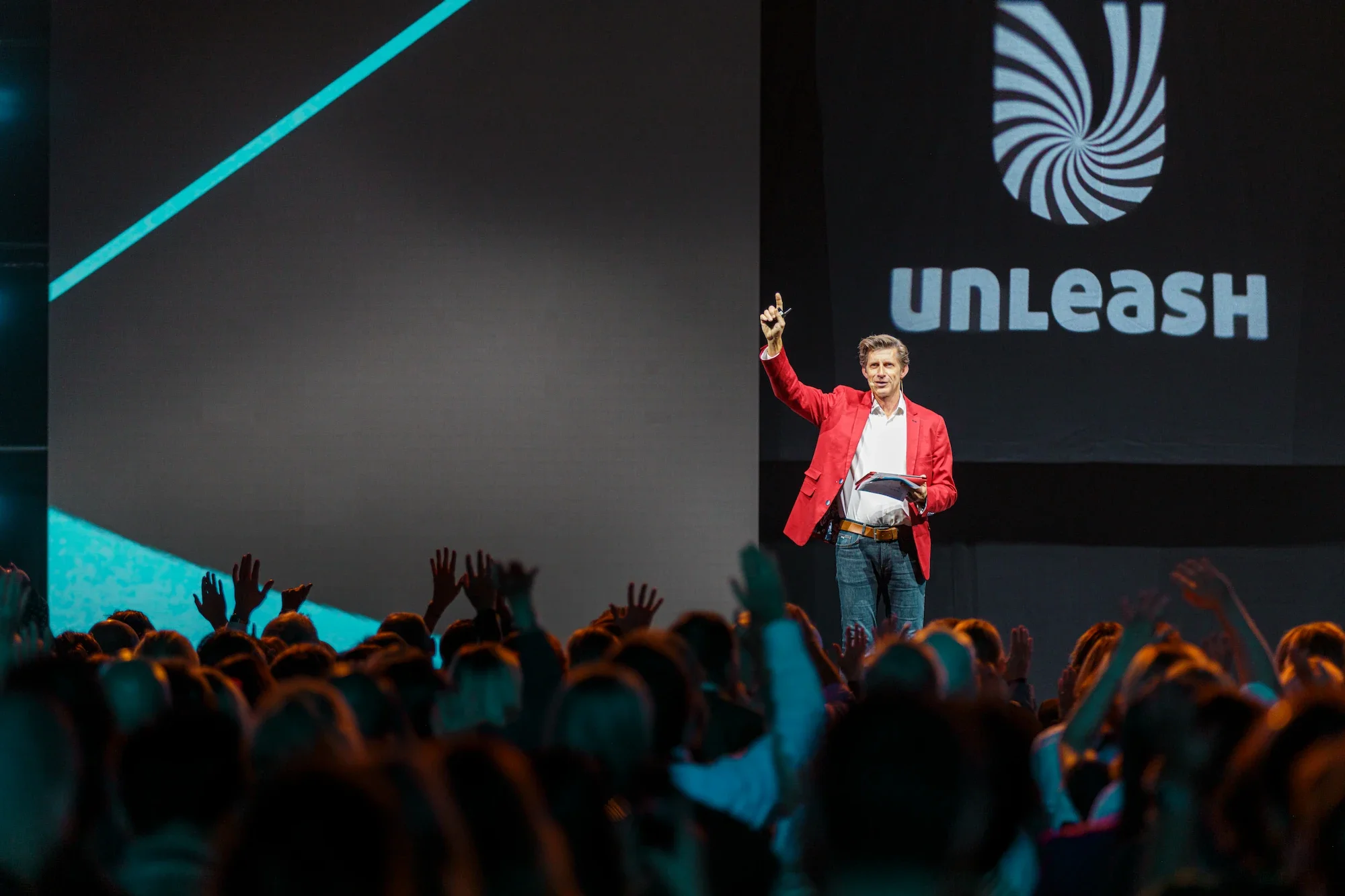 UNLEASH Paris conference host addressing large keynote audience