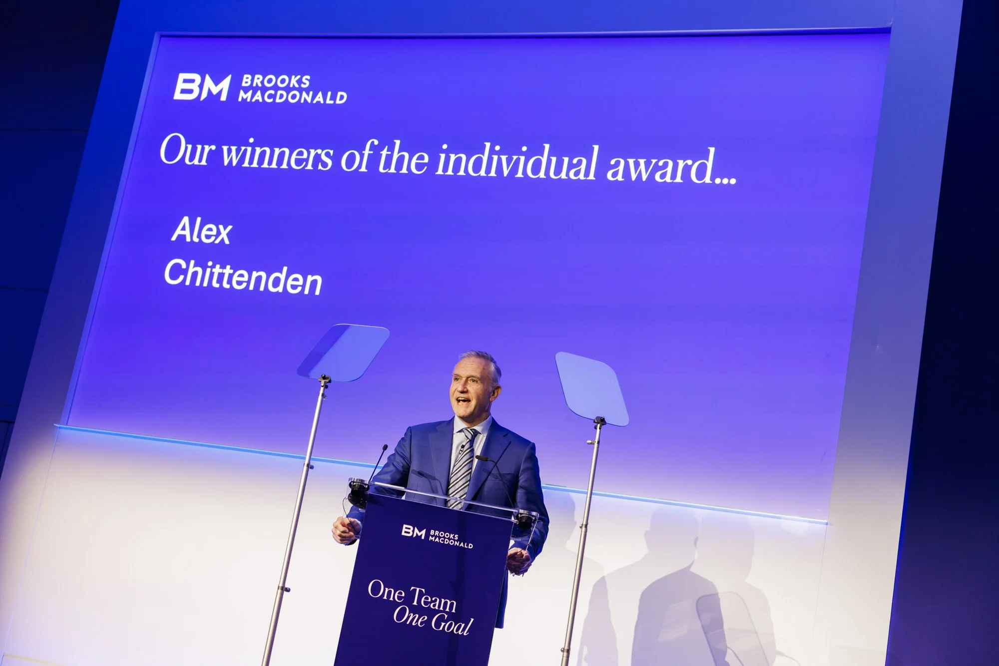 Host announcing award winner during annual conference day in Wembley