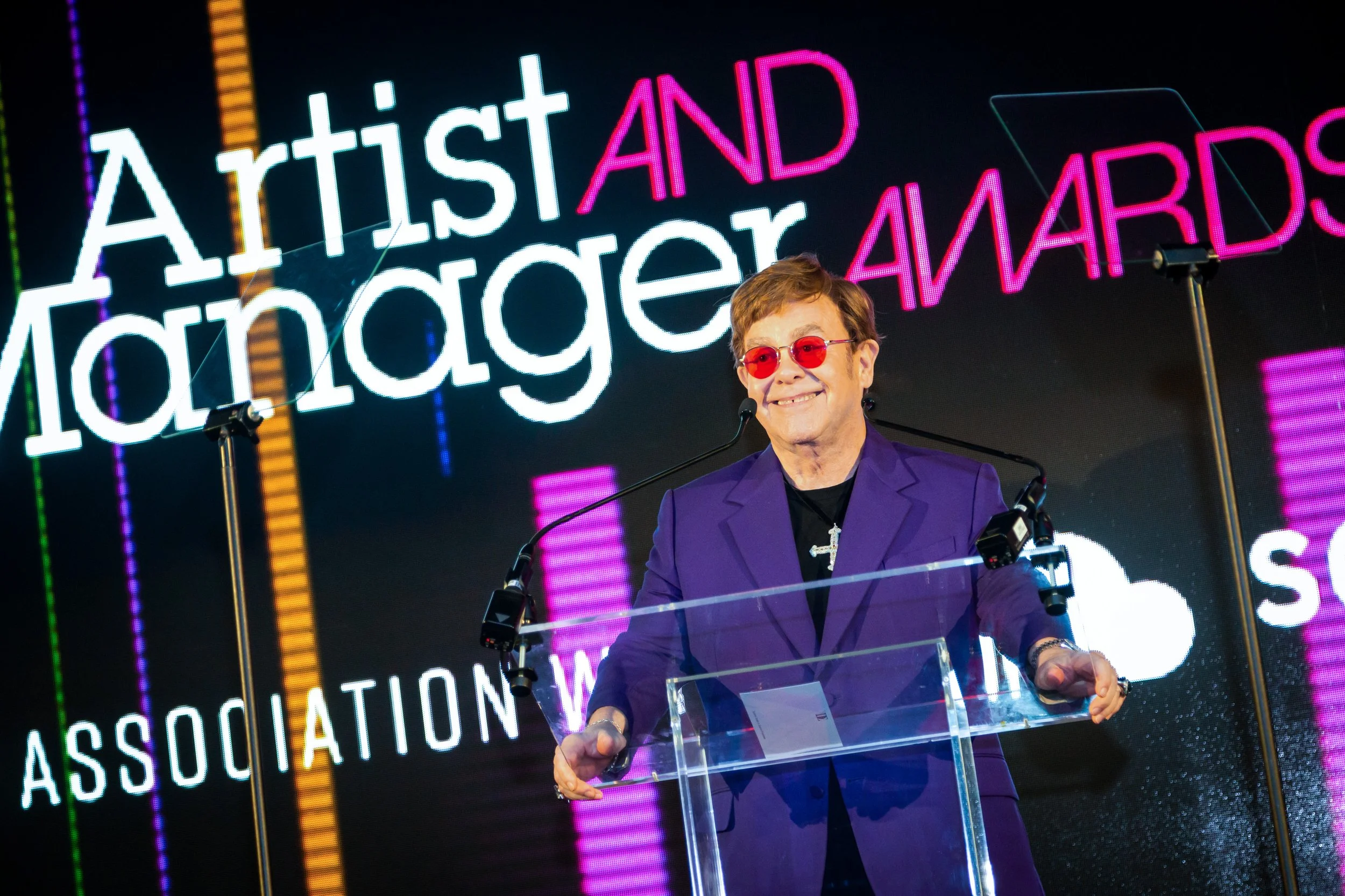 Elton John accepting prize at the Artist and Manager Awards