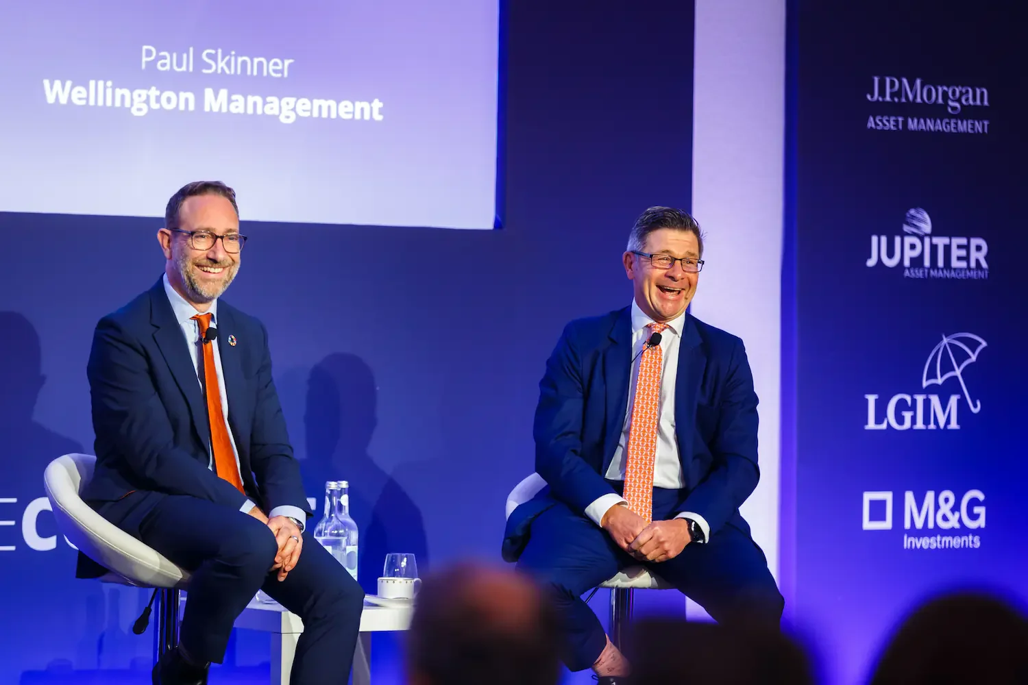 Candid smiles during a panel discussion