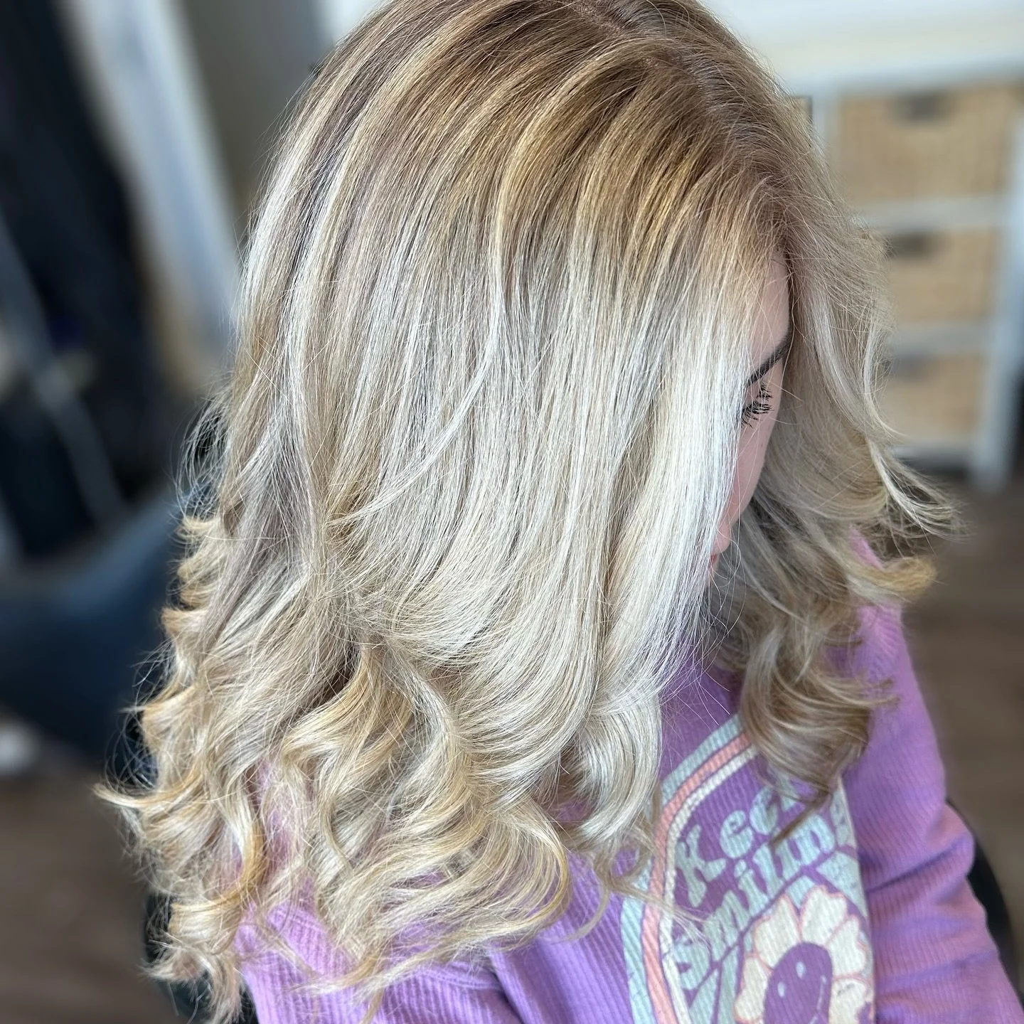 Ever notice how highlighted hair always seems to photograph like a dream? 

The secret? One simple word: dimension.
✨ Dimension makes curls pop.
✨ Dimension softens and hides frizz.
✨ Dimension feels modern, effortless, and yes&mdash;so chic.
And her