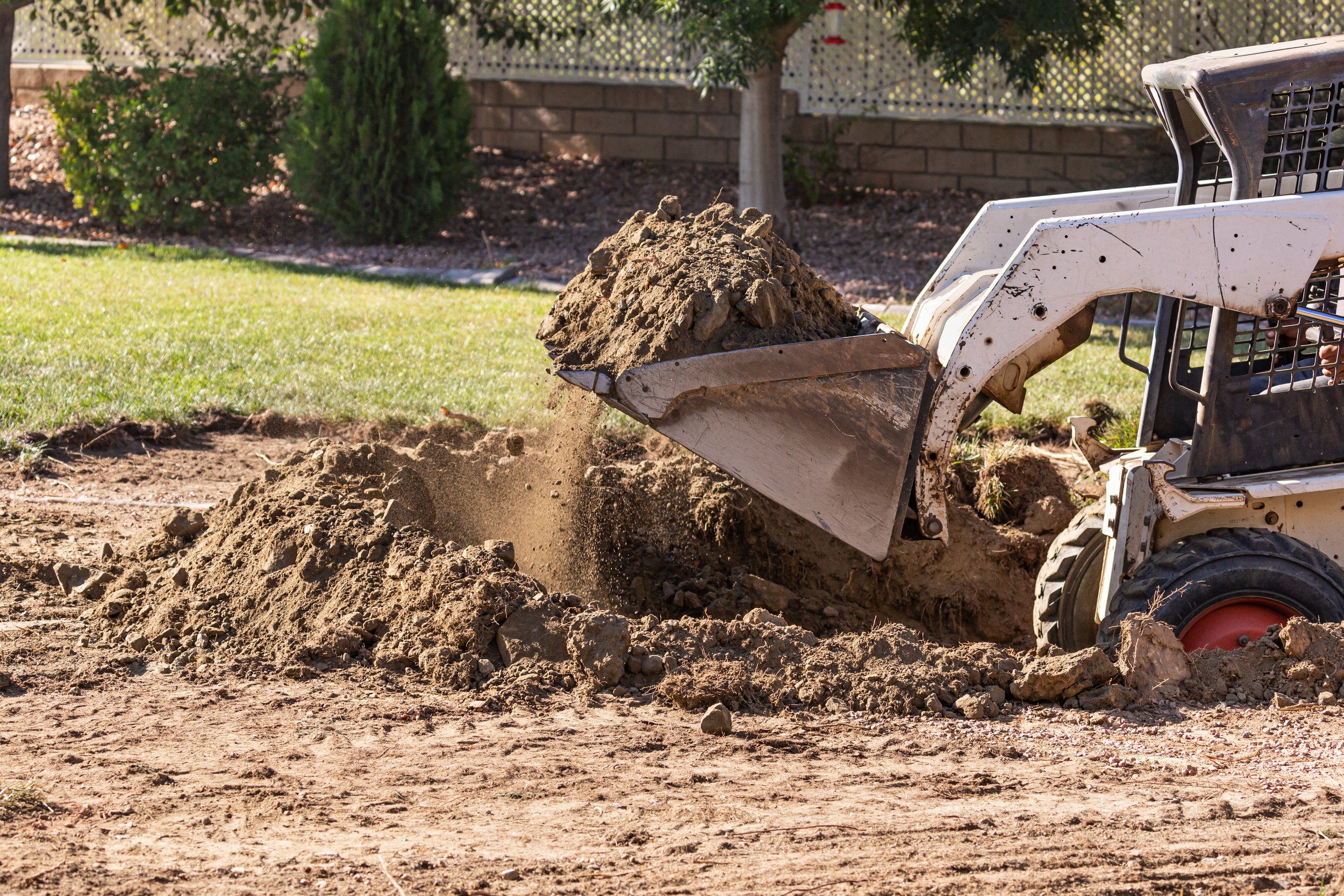 small-bulldozer-digging-in-yard-for-pool-installat-2024-09-11-16-58-28-utc.jpg