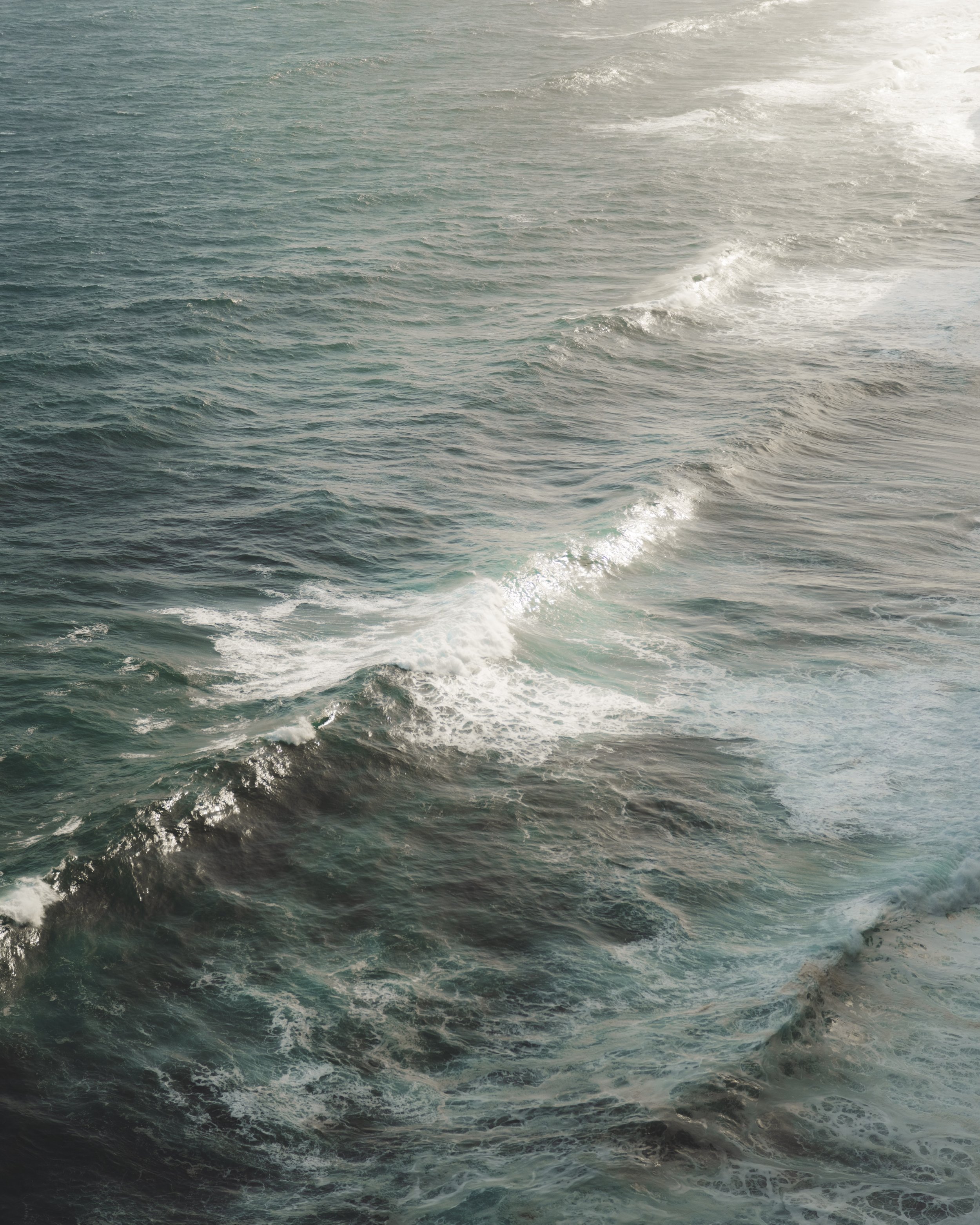 Ocean waves in a golden sunset or sunrise lighting.
