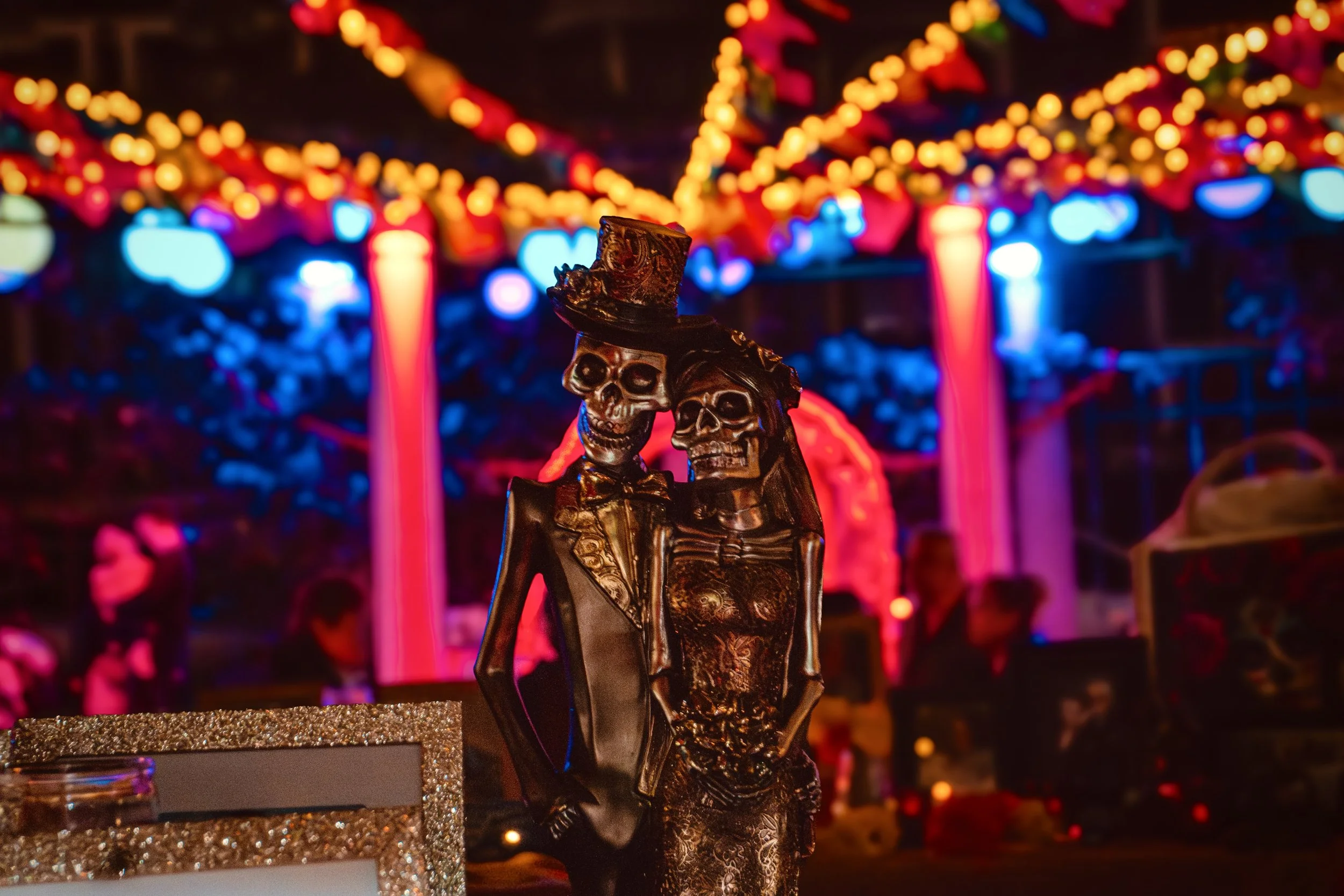 Skeleton couple as part of decorations for Day of the Dead altar.