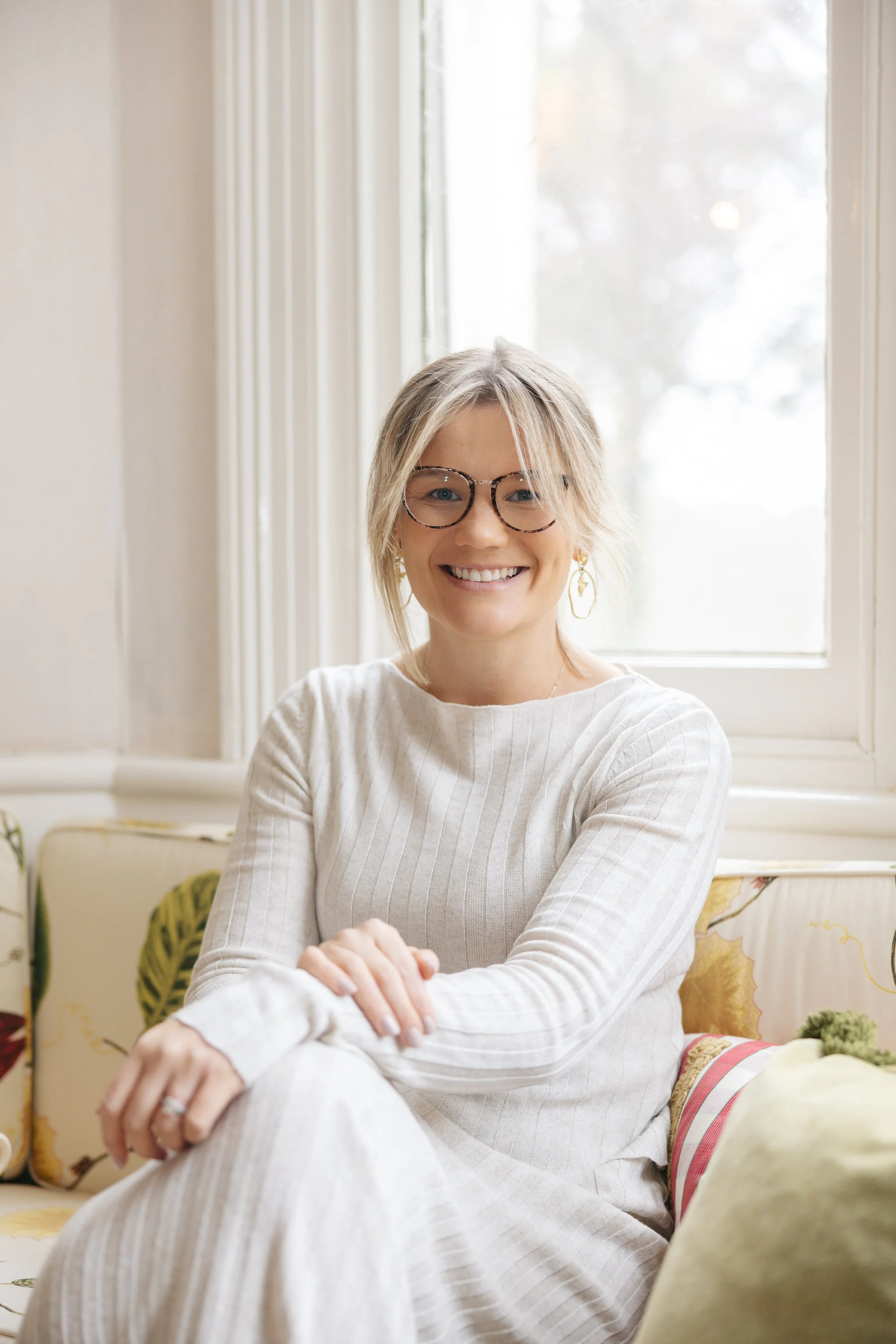 Millie Hardie smiling warmly while seated, representing the approachable and evidence-informed teaching style of The Pocket Psychologist courses.