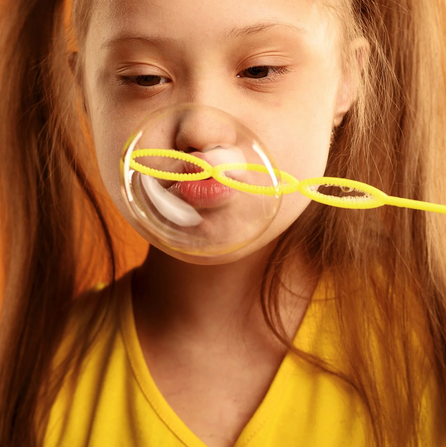 close-up-young-girl-blowing-bubbles.jpg