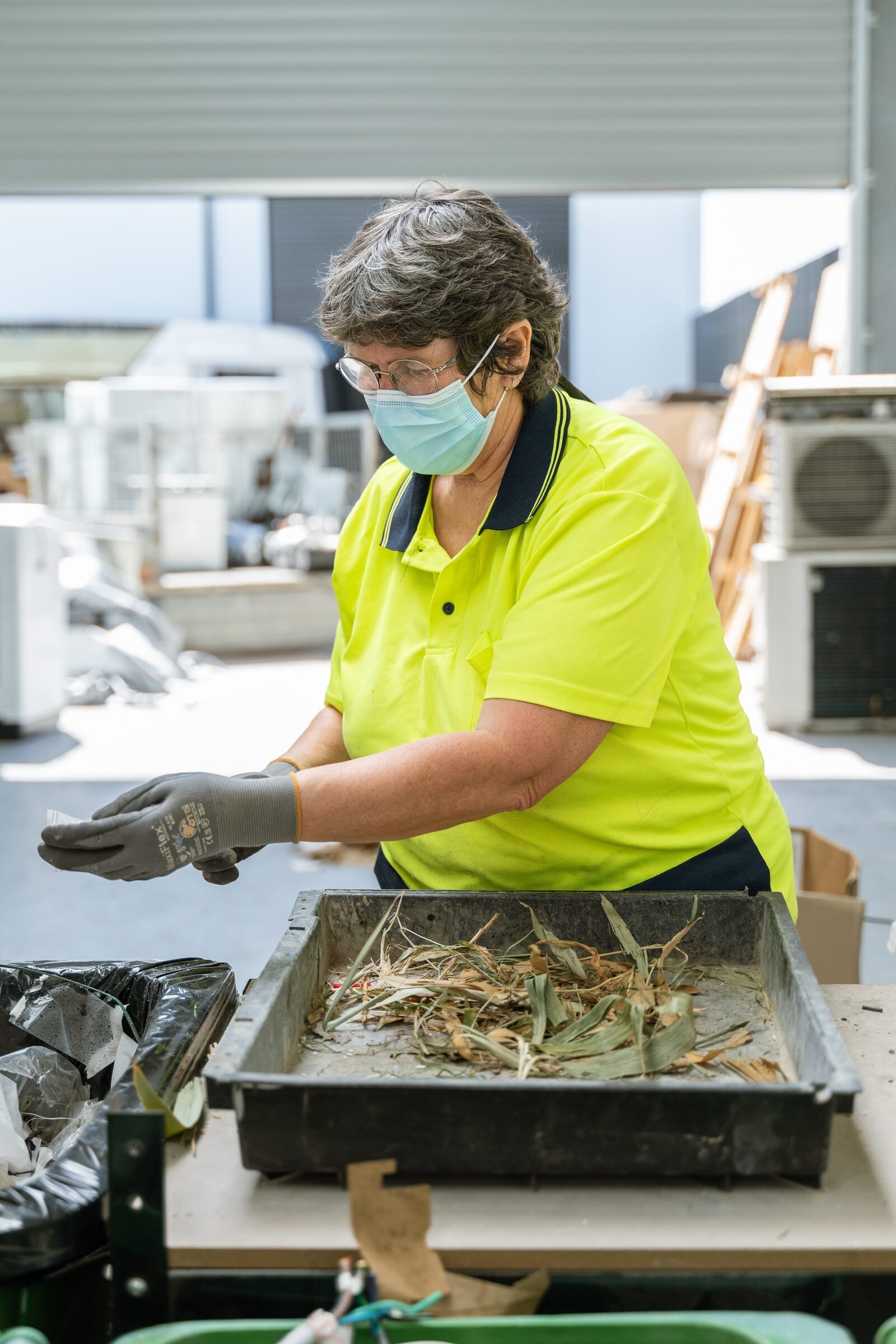 Lindsay sorting waste at the Shox workshop