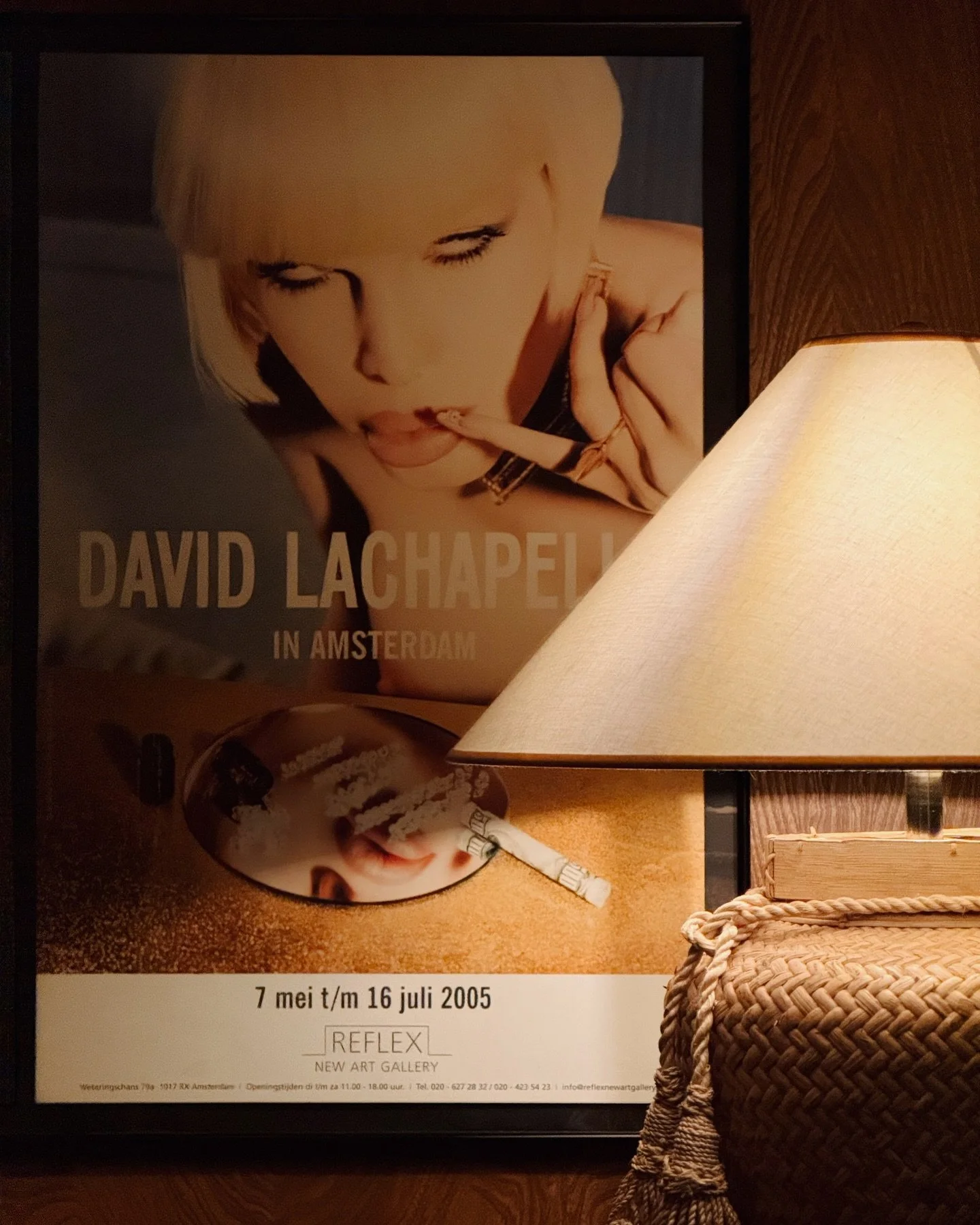 The juxtaposition of provocative pop culture photography with cozy, tactile elements like woven textures and ambient lamp light adds depth and character. It&rsquo;s a reminder that bold art thrives even in intimate spaces.

Tip: Don&rsquo;t be afraid