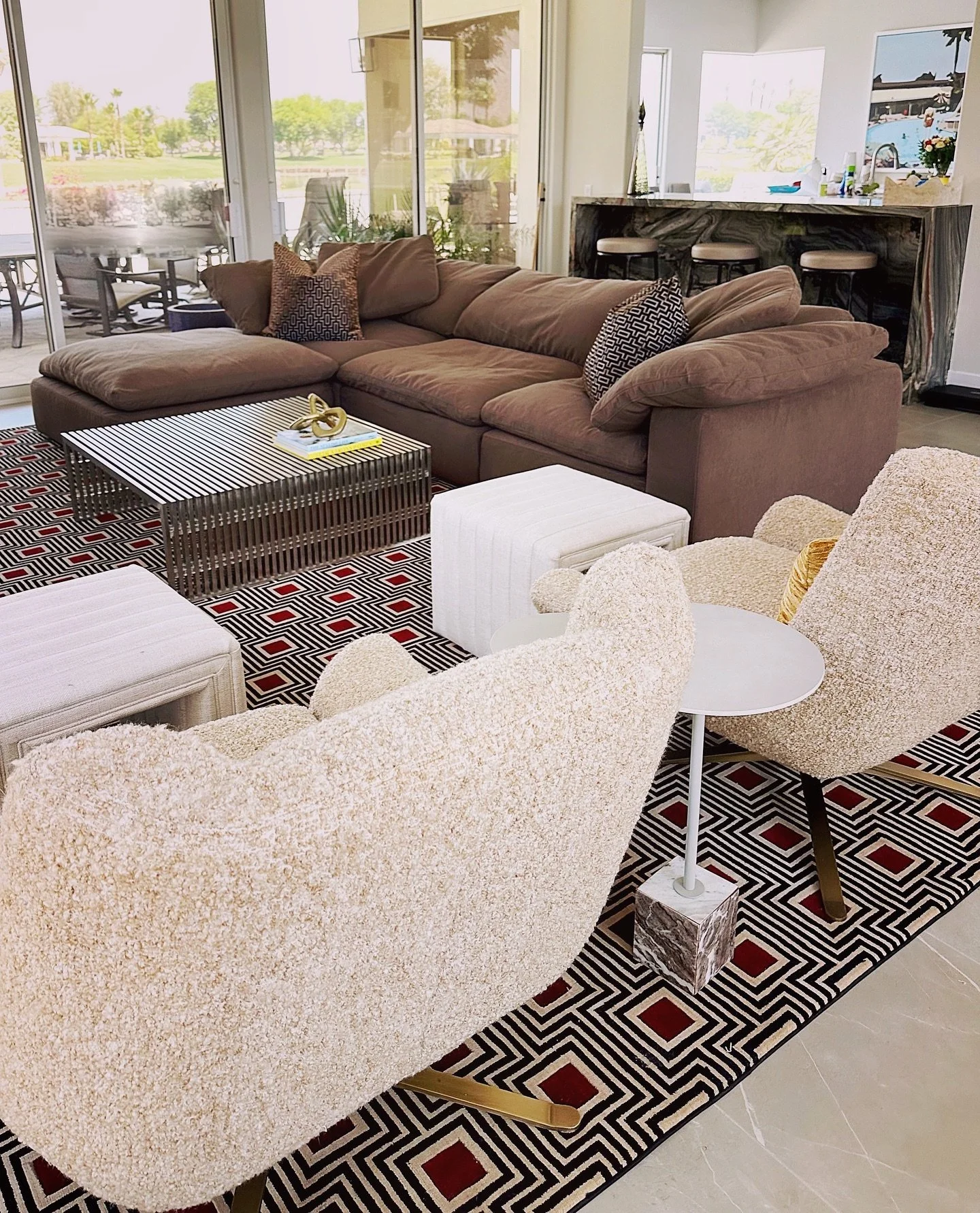 Citrus 🍊 Residence Great Room coming right along!!! New Quartzite pass through bar,  leather swivel stools, custom geometric rug, reupholstered Boucle swivels, and more details on their way&hellip; Exciting to see this come together. #interiordesign