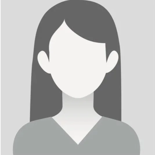 A grayscale illustration of a woman with long hair and a V-neck top, with no facial features.