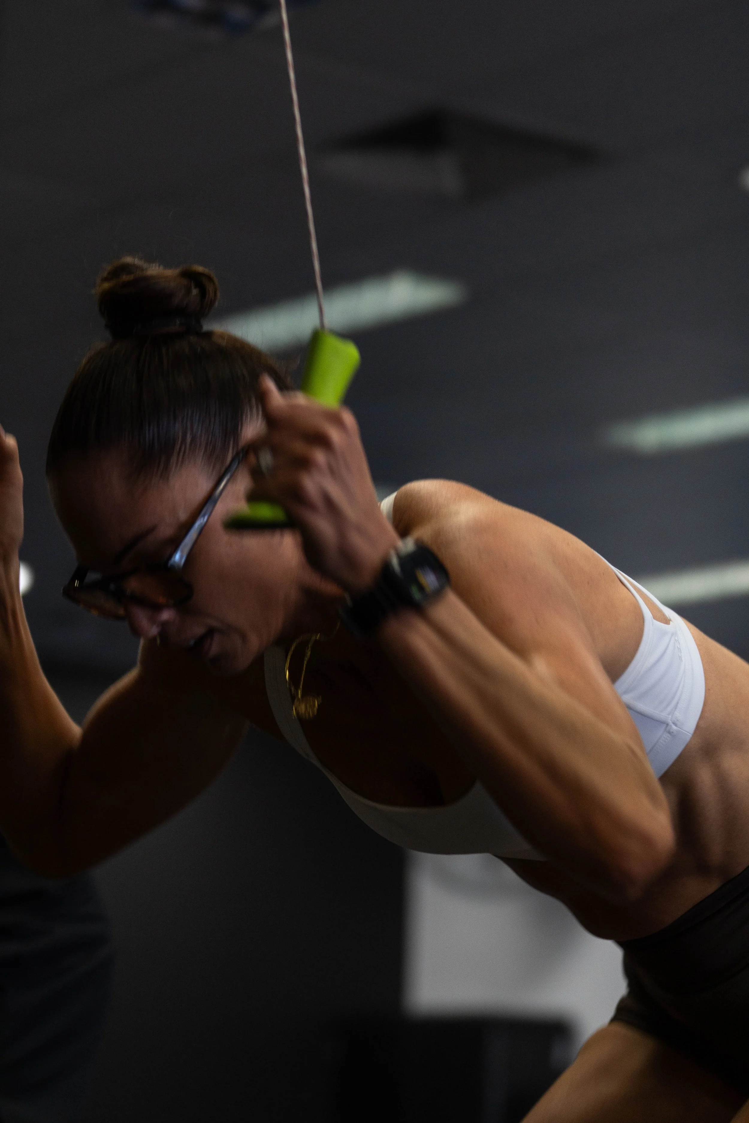 A woman doing a workout with resistance bands in a gym