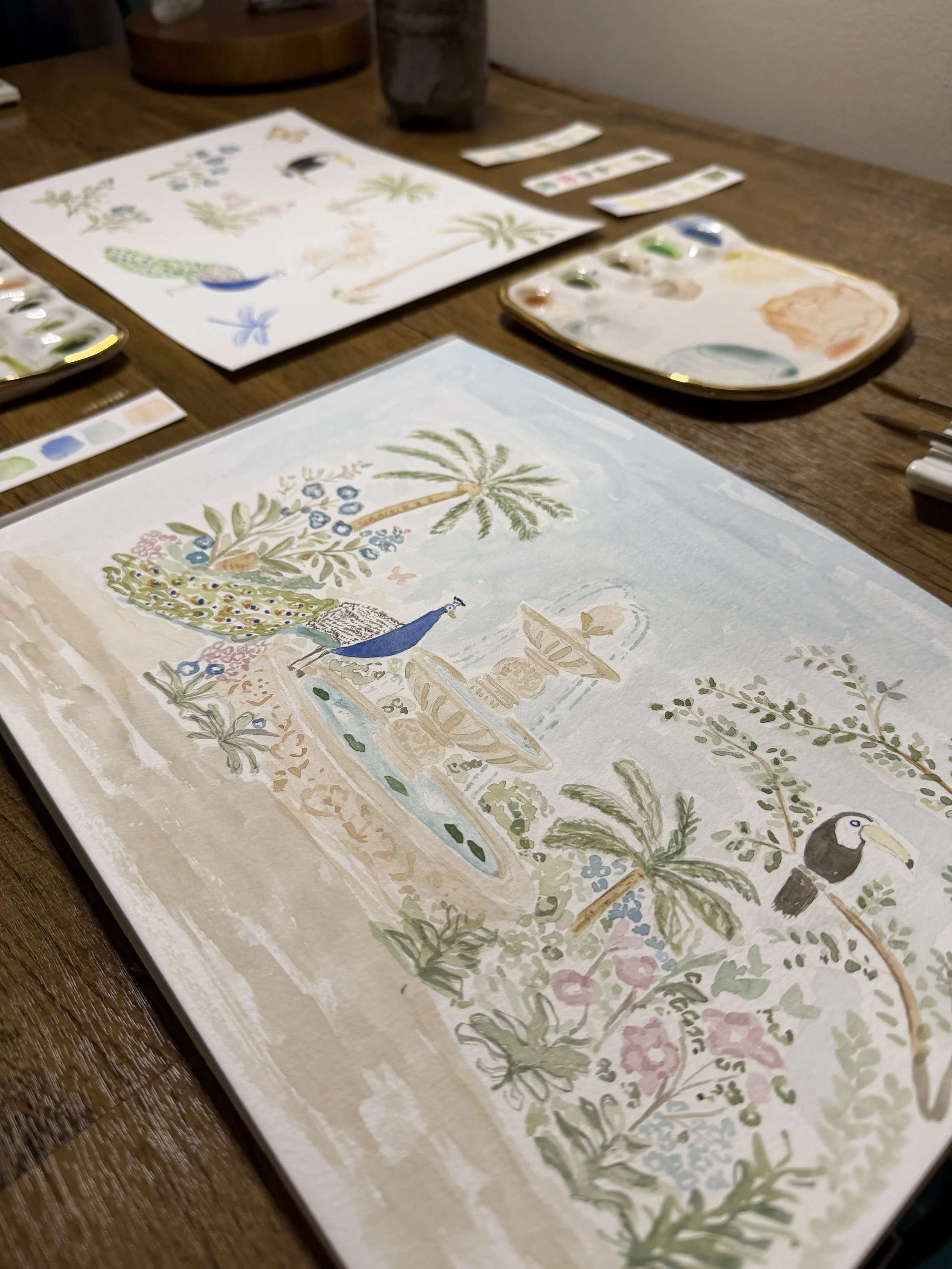 Watercolor painting with a watercolor palette on a desk