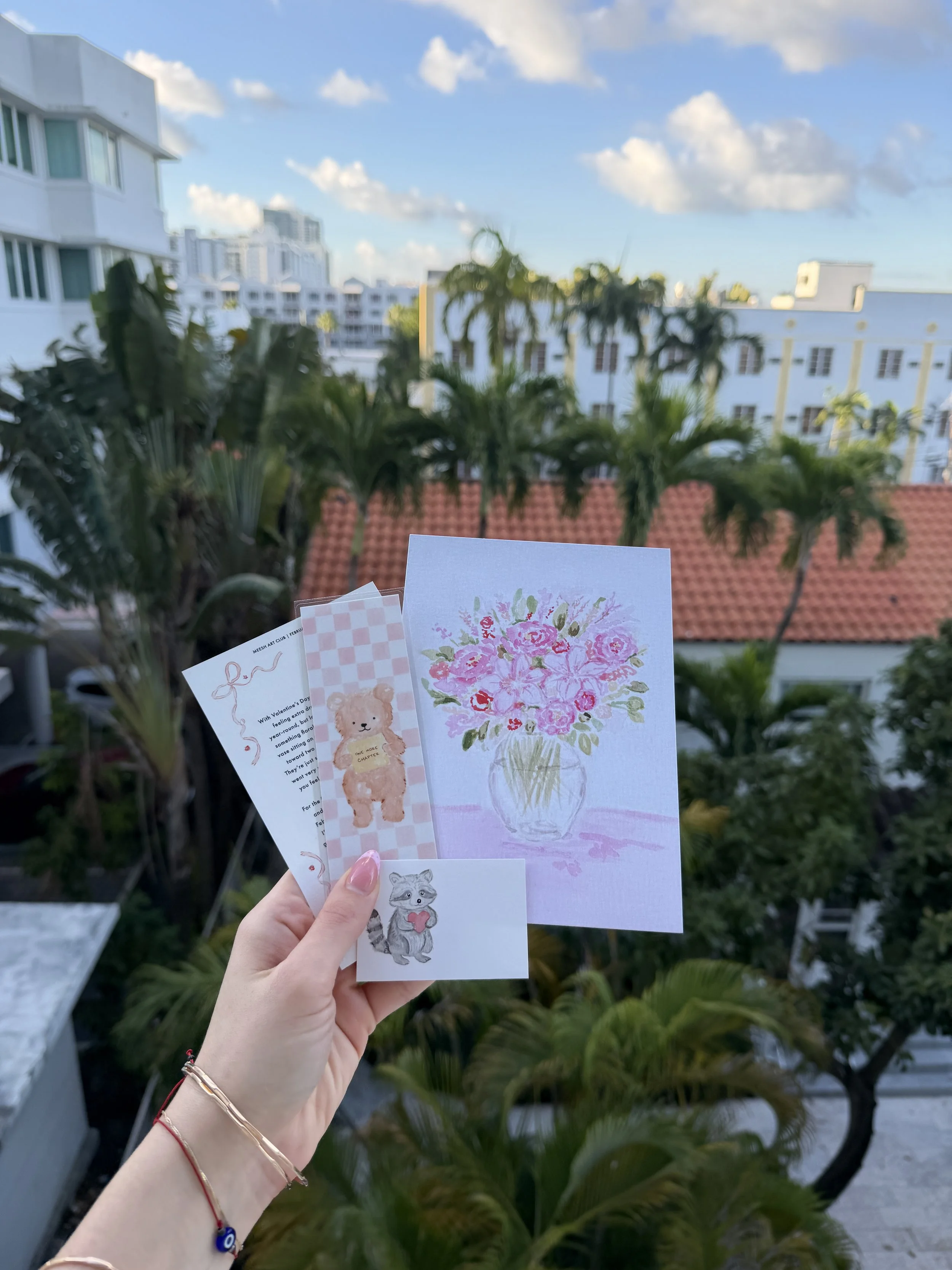 Art artwork of roses, a bookmark and a tiny note