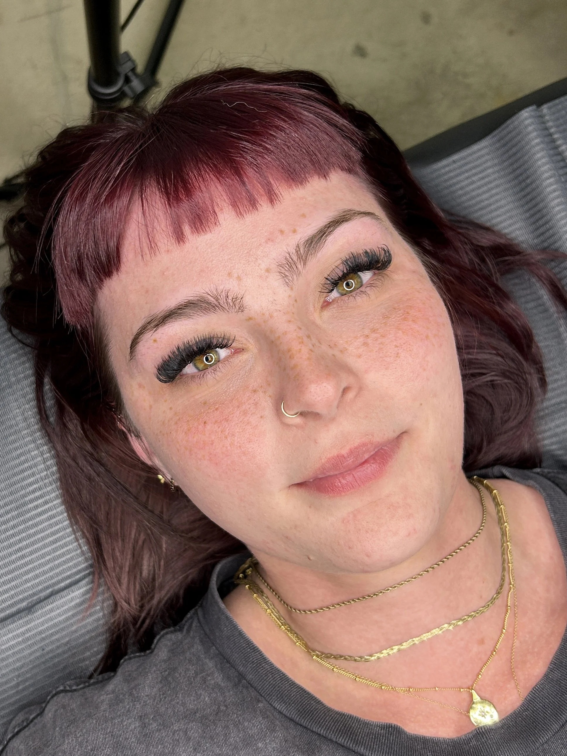Healed natural-looking freckle tattoos by Iona Wallace in Las Vegas.