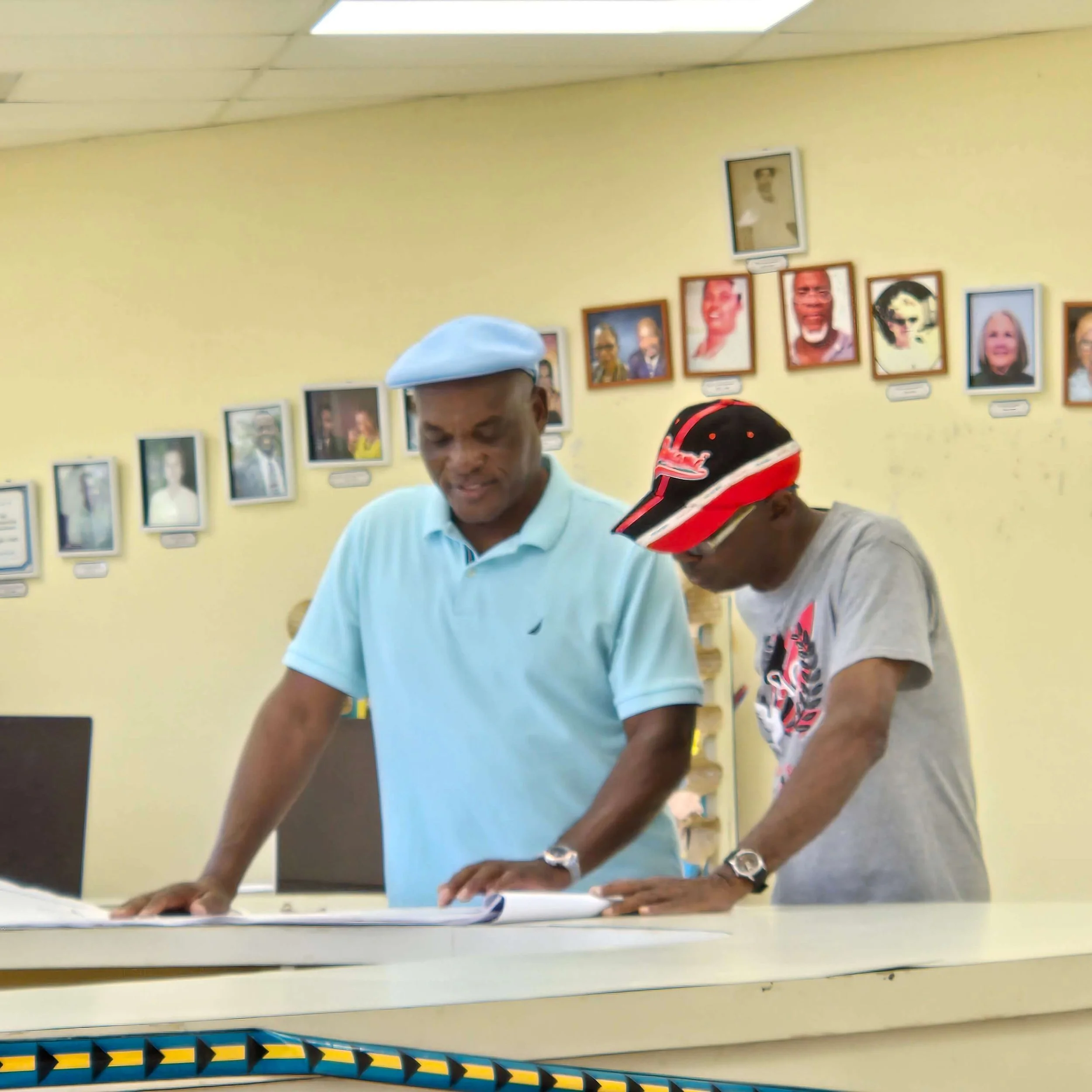 Staniel Cay Life - Staniel Cay Medical Clinic Rebuild - Reviewing Plans at a Community Meeting