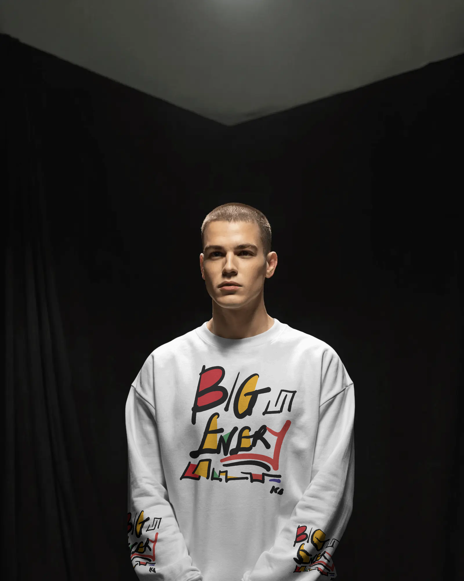 studio-portrait-sweatshirt-mockup-male-model-under-focused-overhead-light-0676.png