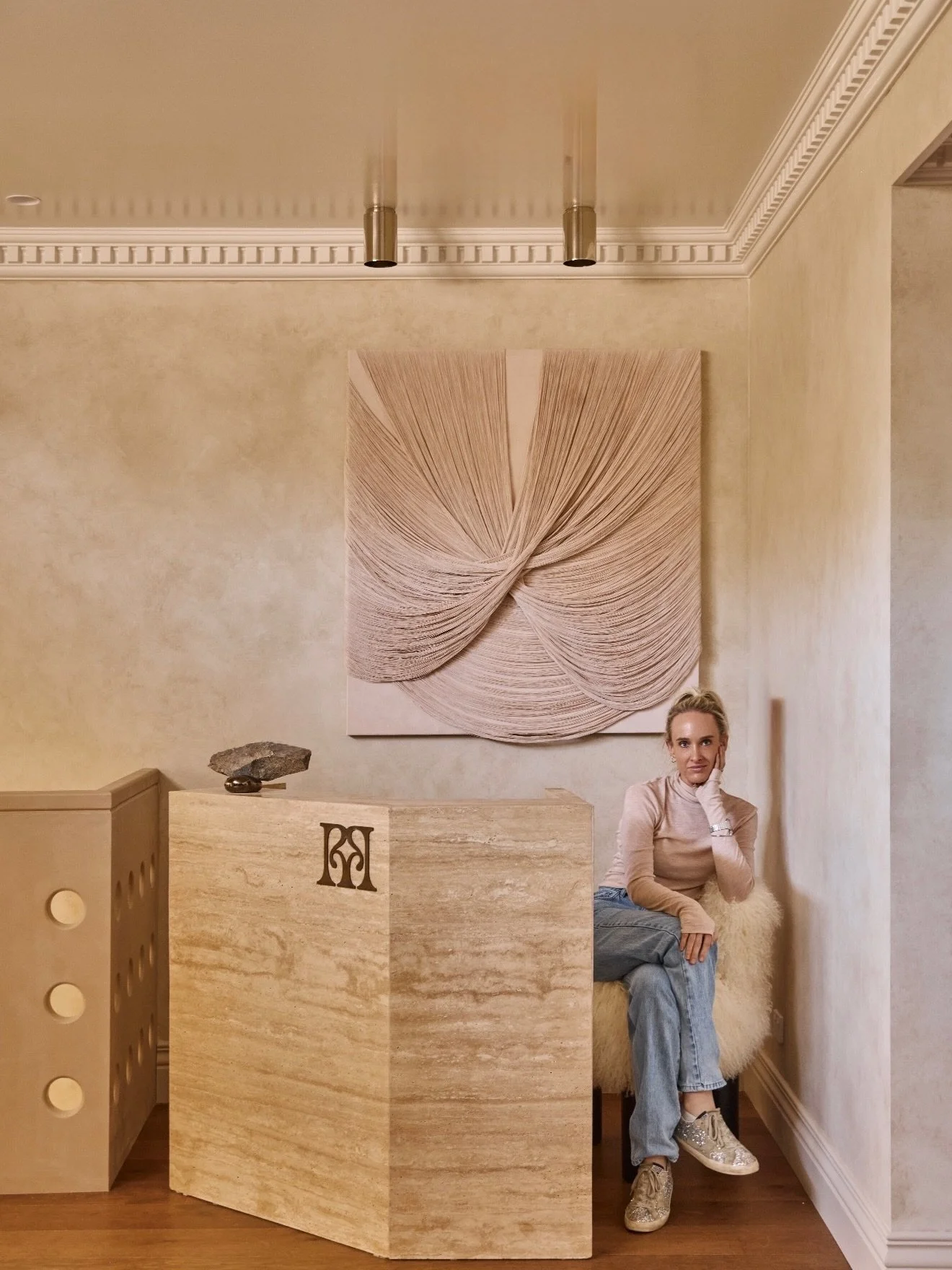 THE RECEPTION @riya.studios 

Custom built by @unrivalled.stone to sit like a monolithic rock, grounding the space and embracing earthly elements. We softened the brutalist design of the desk with an incredible feminine delicate work by @grazielaguar