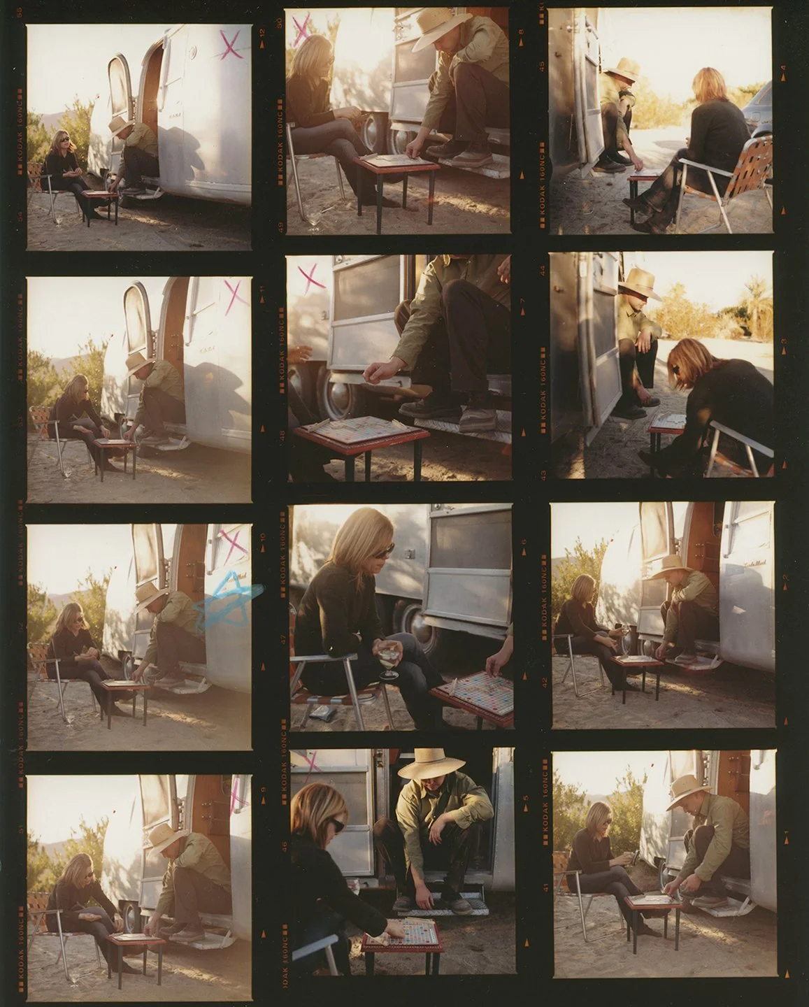 contact sheet of couple in desert playing scrabble at magic hour outside their airstream