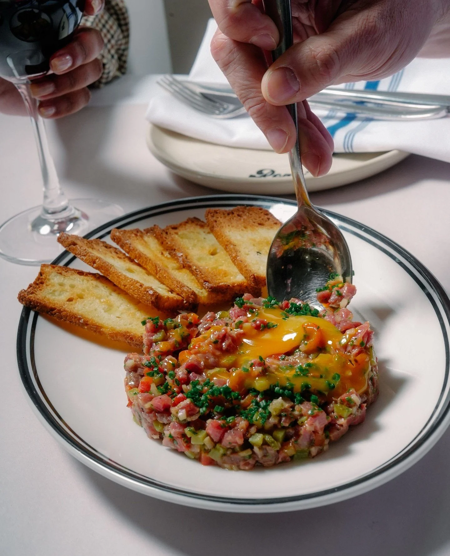 Beef Tartare, enriched with red pepper, confit egg yolk, and finished with fresh chives. Mix and serve on crisp focaccia crackers. A must try from our new Spring menu.⁠
⁠
#RonniesMelbourne #SpringMenu #BeefTartare #ItalianDining #MelbourneFood #Foodi