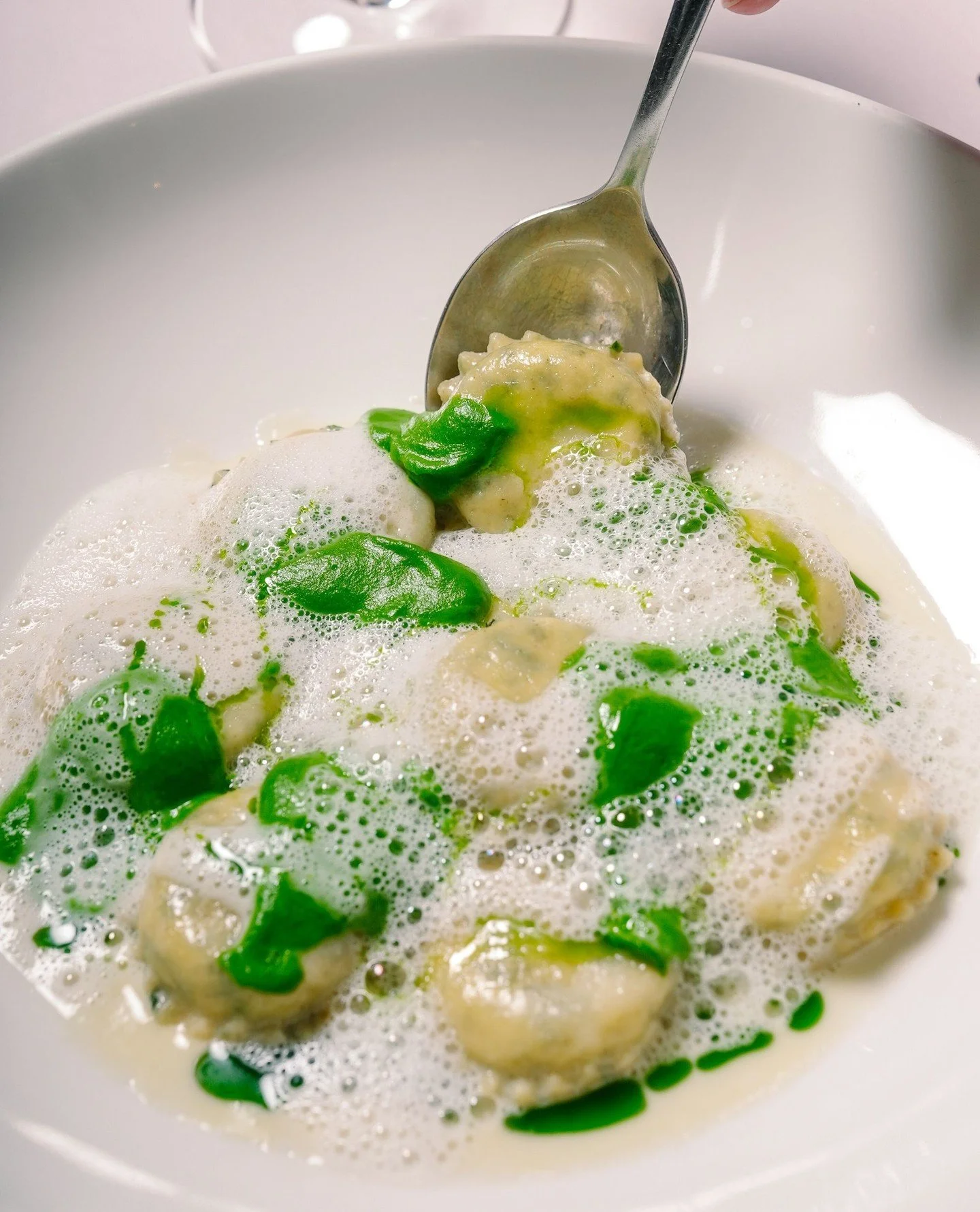 Spinach + Ricotta Girasoli, served with silky leek pur&eacute;e, light shallot foam, and a drizzle of herb oil - a springtime favourite.⁠
⁠
#SpringMenu #MelbourneEats #MelbourneFoodie #MelbourneRestaurants #PastaLovers #FreshPasta #ItalianDining #Foo