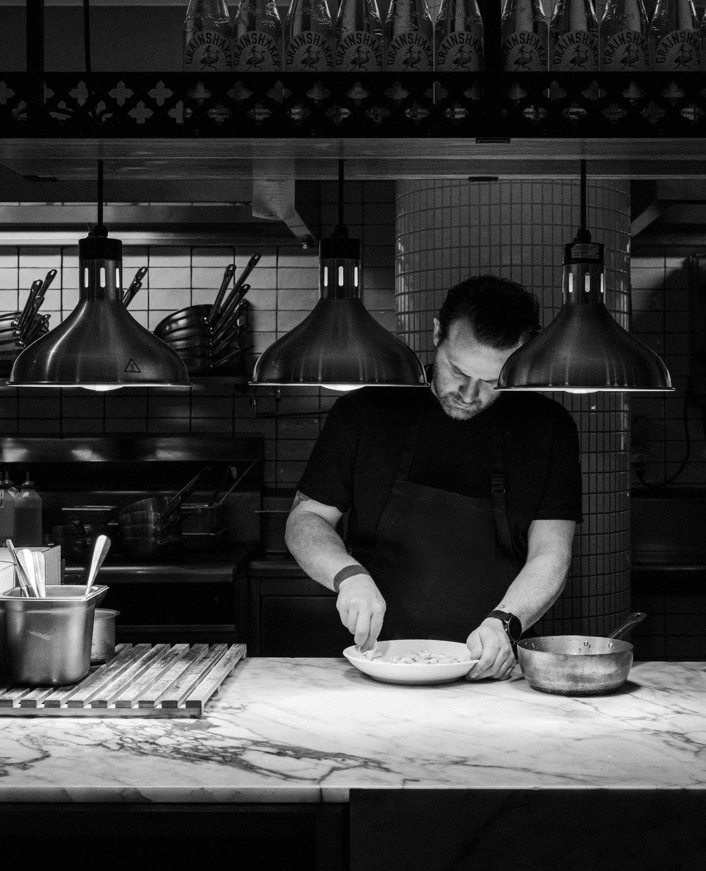 At the pass and in his element, Ronnie's Head Chef Matthew.⁠
⁠
#RonniesMelbourne #HeadChef #MelbourneDining #HospitalityLife #MelbourneRestaurants