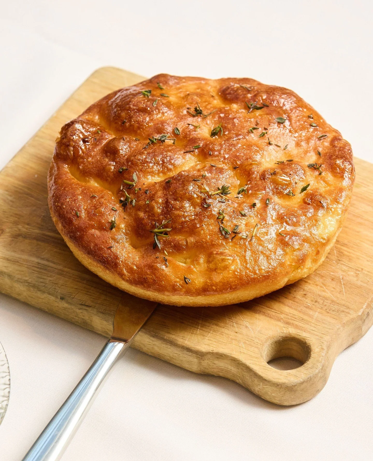 Ronnie&rsquo;s signature Fermented Potato Focaccia. Rip and generously dip into our house-made whipped cod bottarga.⁠
⁠
#RonniesMelbourne #Focaccia #WhippedCod #Bottarga #MelbourneFoodies #MelbourneCBD #Rialto