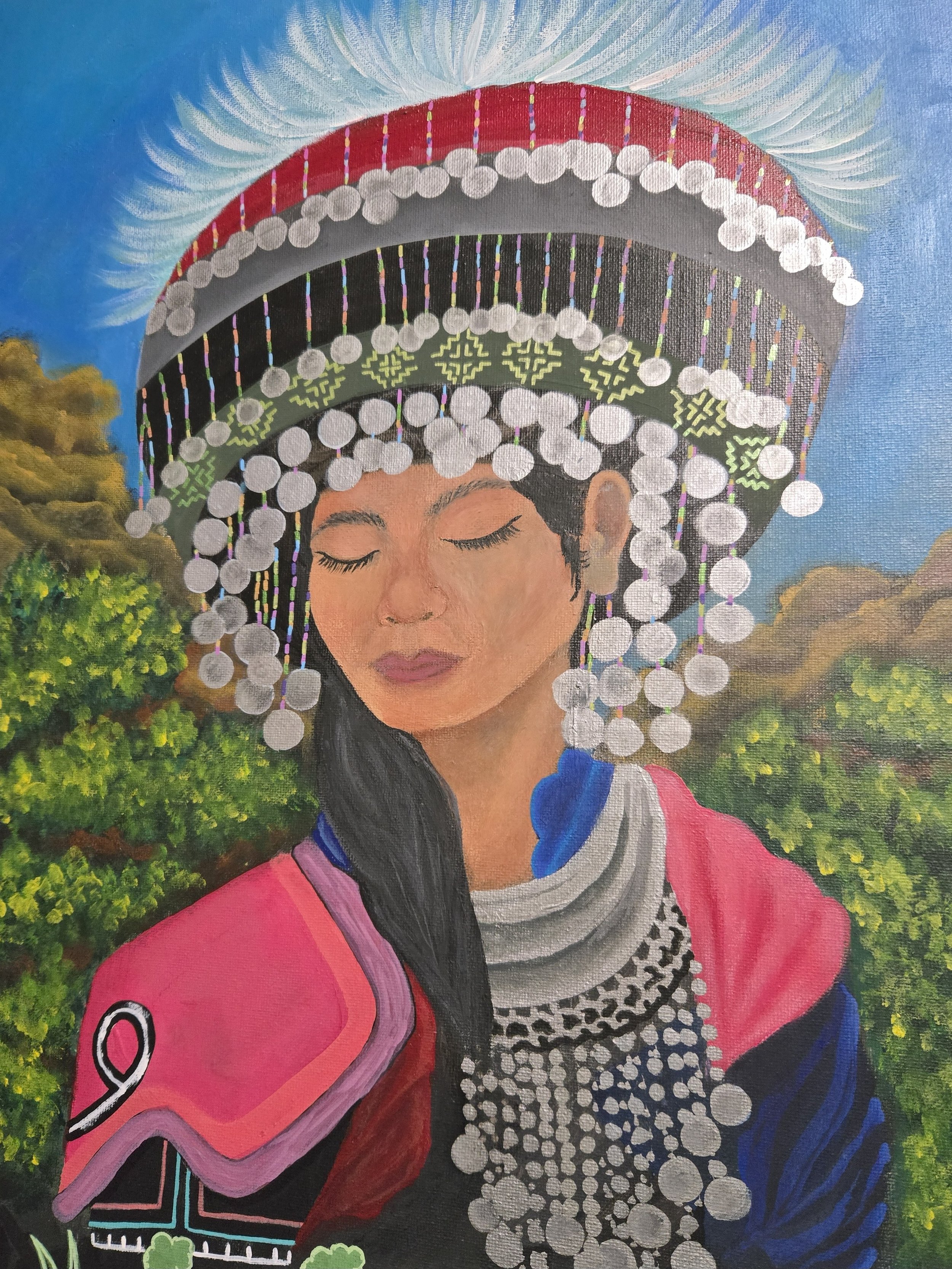 Painting of a woman with long black hair wearing traditional clothing, including a decorated headdress with white beads and colorful woven patterns, set against a landscape background with trees and a blue sky.