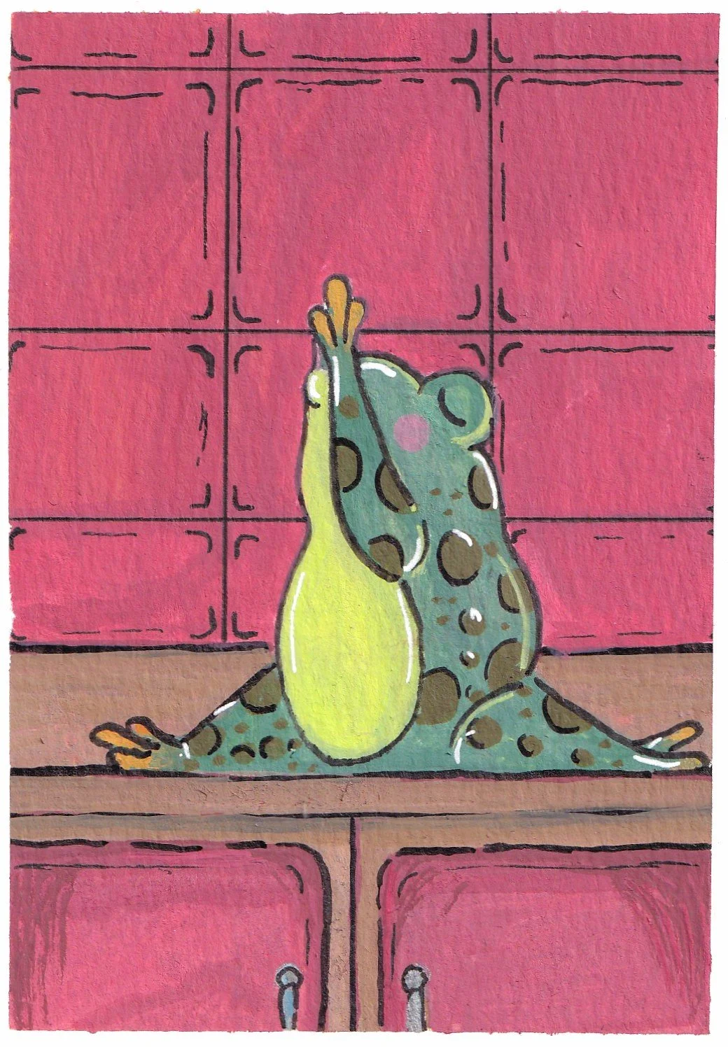 A cartoon frog sitting on a wooden surface with a pink tiled wall in the background, raising its hands above its head.