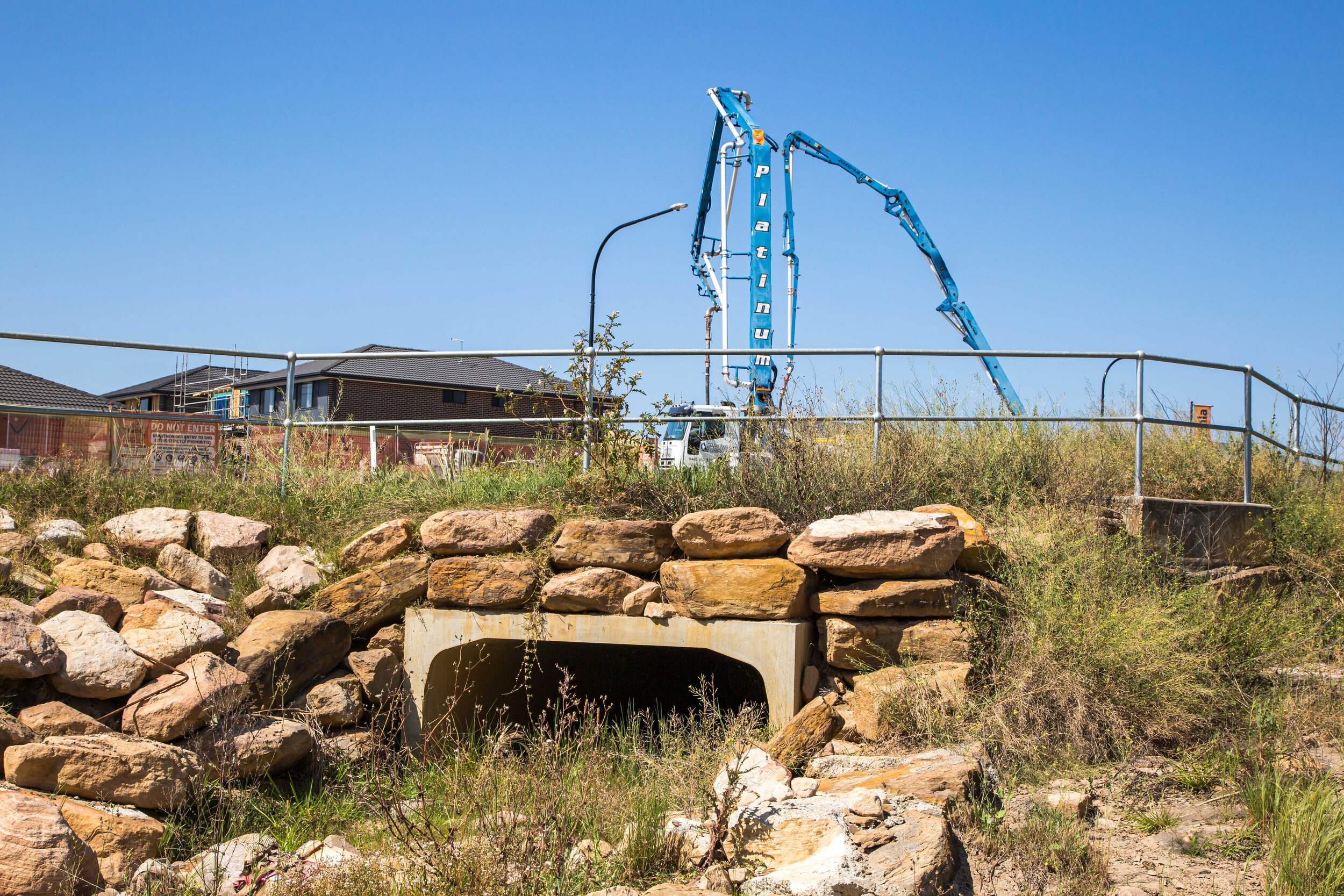 Creek supporting native plants and wildlife habitat replaced with rocks and concrete.