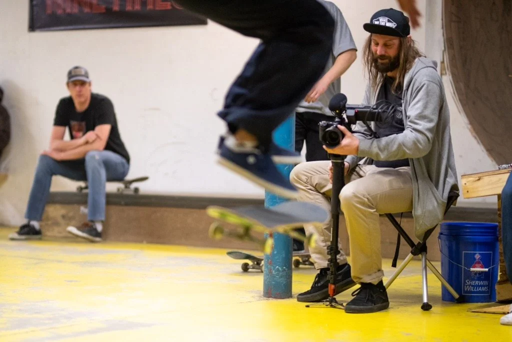 Right to Skate president Liam Richards holds a camera in saskatoon at electric umbrella for sports