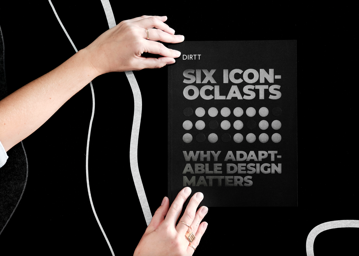 Hands holding Iconoclast magazine up