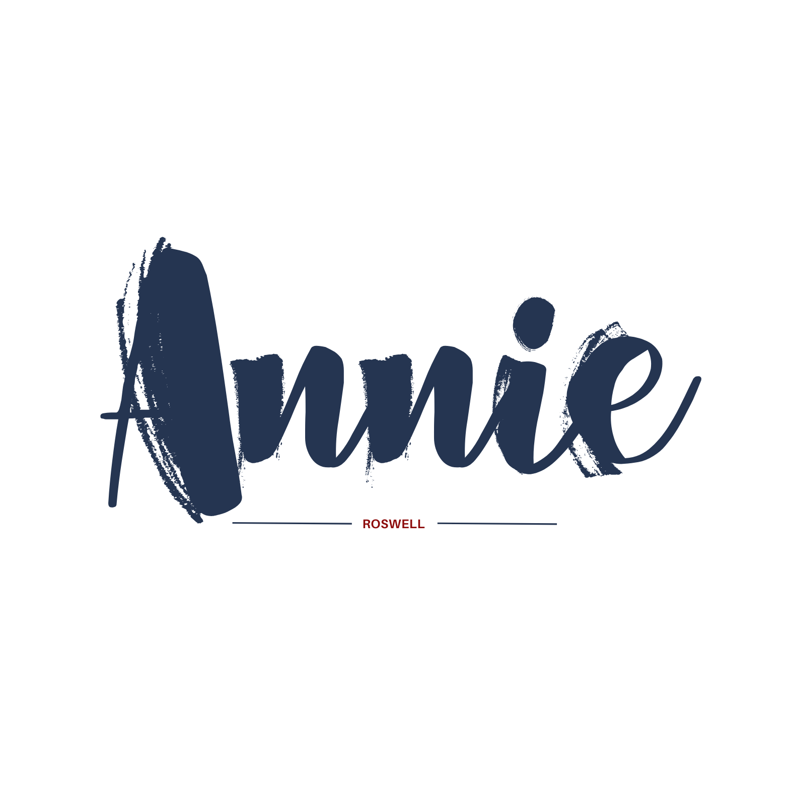 Stylized text displaying the name "Annie" in bold navy blue brush stroke font with a small red "Roswell" underneath, flanked by thin black lines.
